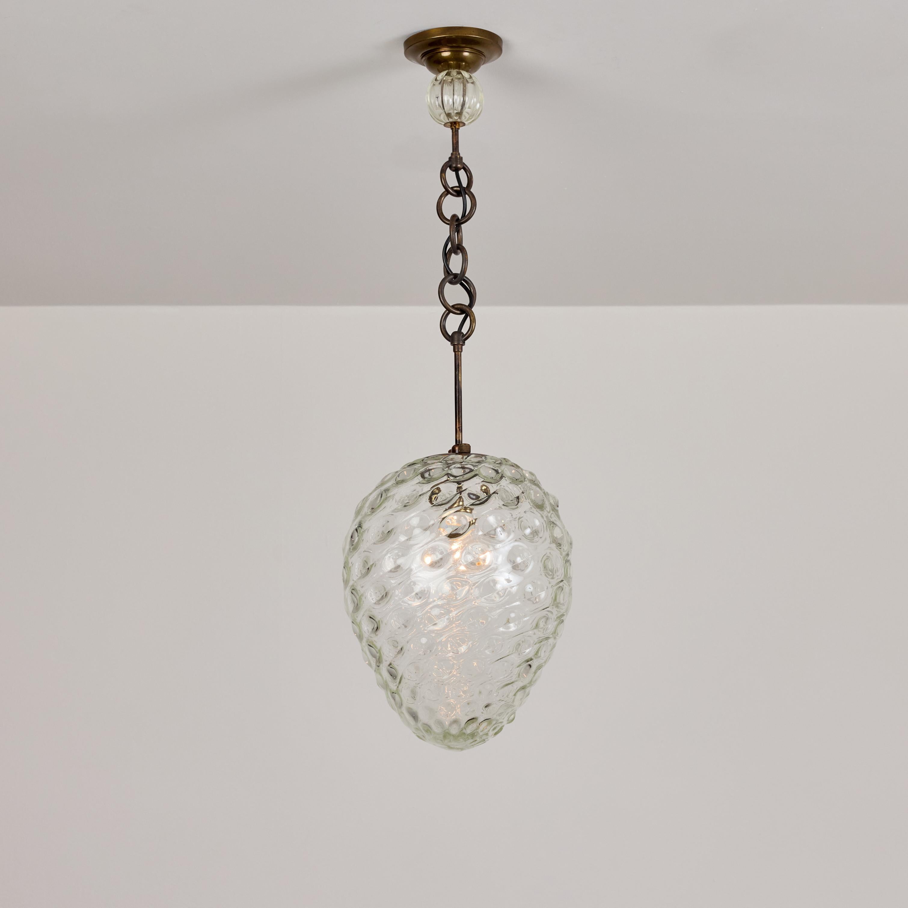 Pendant by Flavio Poli for Seguso. Designed and manufactured in Italy, circa the 1940's. Hand-blown and molded Murano glass. Aged brass ring suspension. Custom Rewire brass backplate. Wired for U.S. standards. We recommend one 40- 60w maximum bulb.