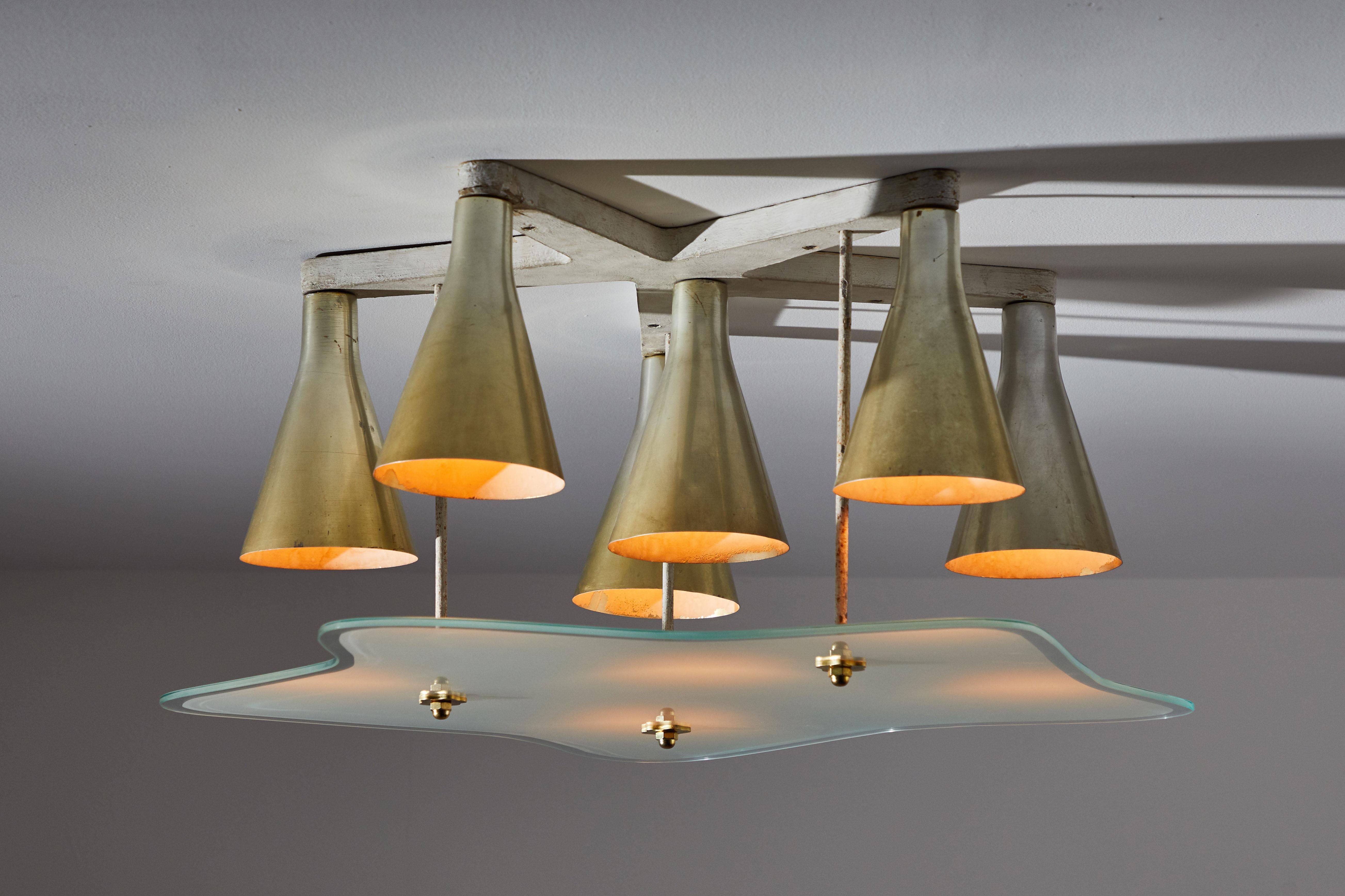Ceiling light by Giuseppe Ostuni. Designed and manufactured in Italy, circa 1950s. Lacquered wood structure, brass reflectors and sanded glass diffuser. Rewired for US junction boxes. Takes nine E26 European candelabra 25w maximum bulbs. Bulbs