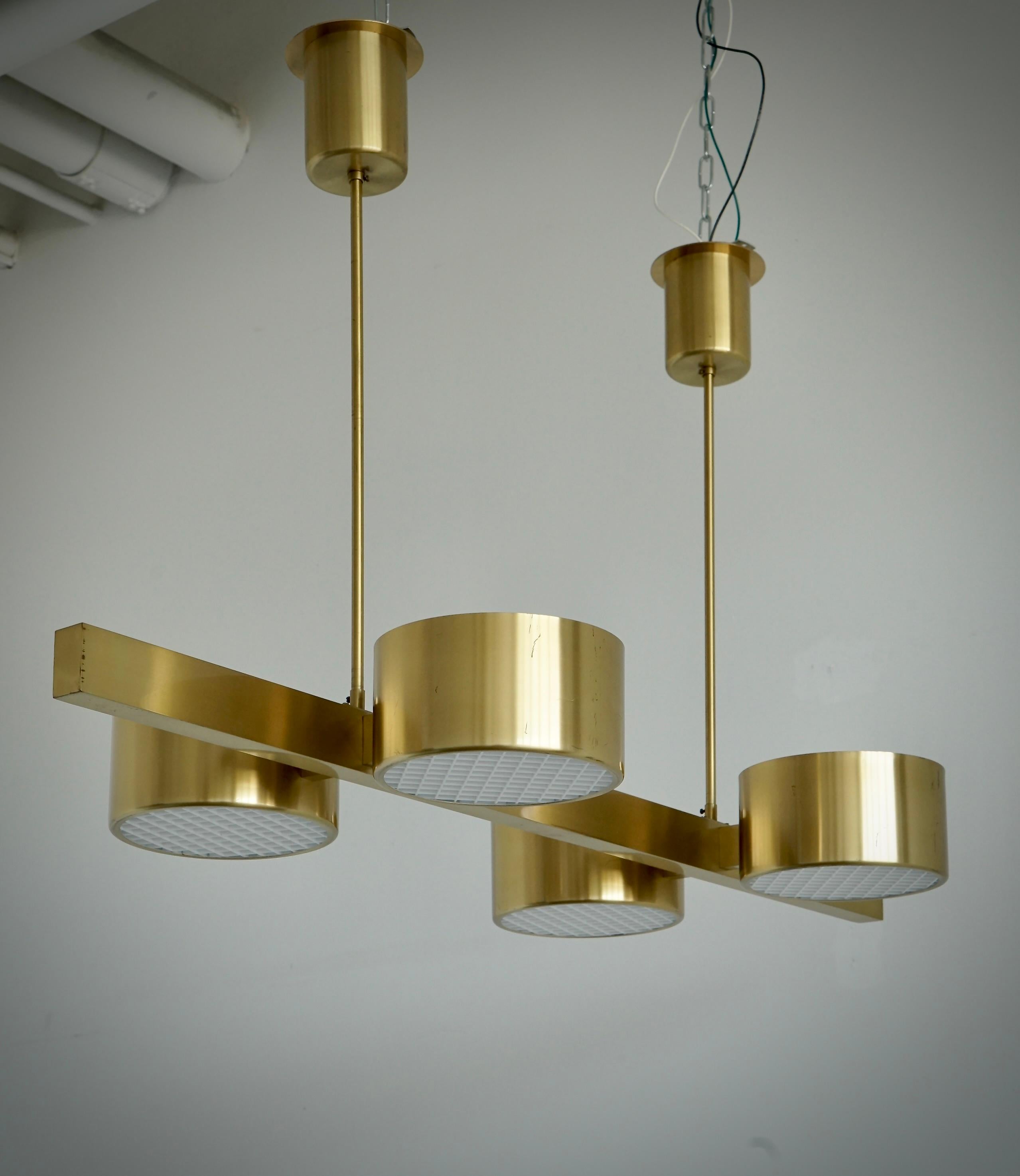 Ceiling light designed by Hans-Agne Jakobsson for Markaryd , Sweden. Model T261/4. Circa 1970th. Polished brass .
Newly rewired with UL certification.
Minor scratches, 6 brass screw on top of the bar from previous installation.