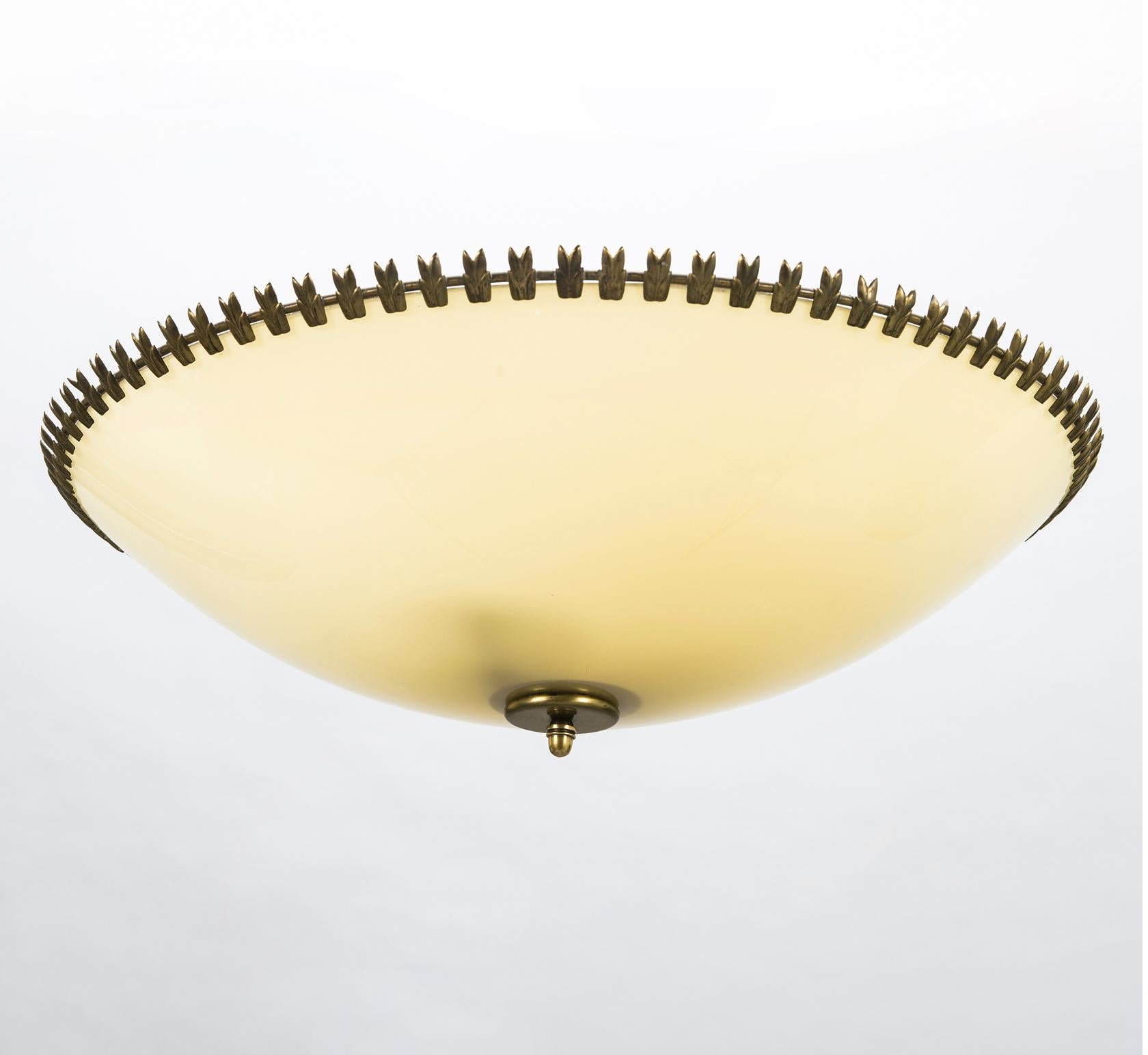 Large  ceiling light designed by Lisa Johansson-Pape, Model '71007', manufactured by Stockmann Orno. Finland , circa 1950th.
Opal glass shade with patinated brass decorations. Manufacturer stamp. Diameter 22.5