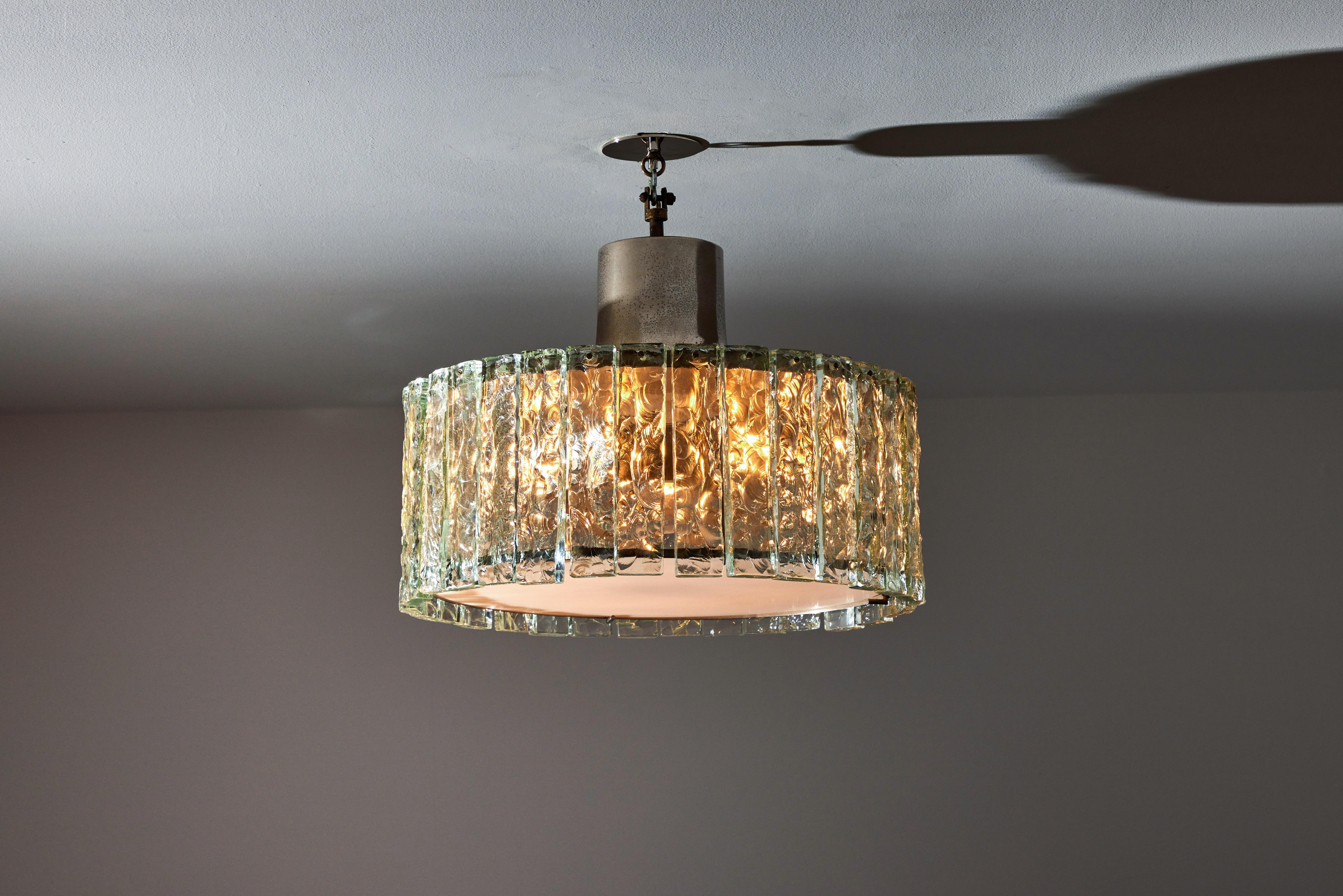 Ceiling light by Max Ingrand for Fontana Arte. Manufactured in Italy, circa 1950's. Crystal, chrome, glass, custom brass backplate. Wired for U.S. standards. We recommend eight E14 25w maximum bulbs. Bulbs provided as a one time courtesy.