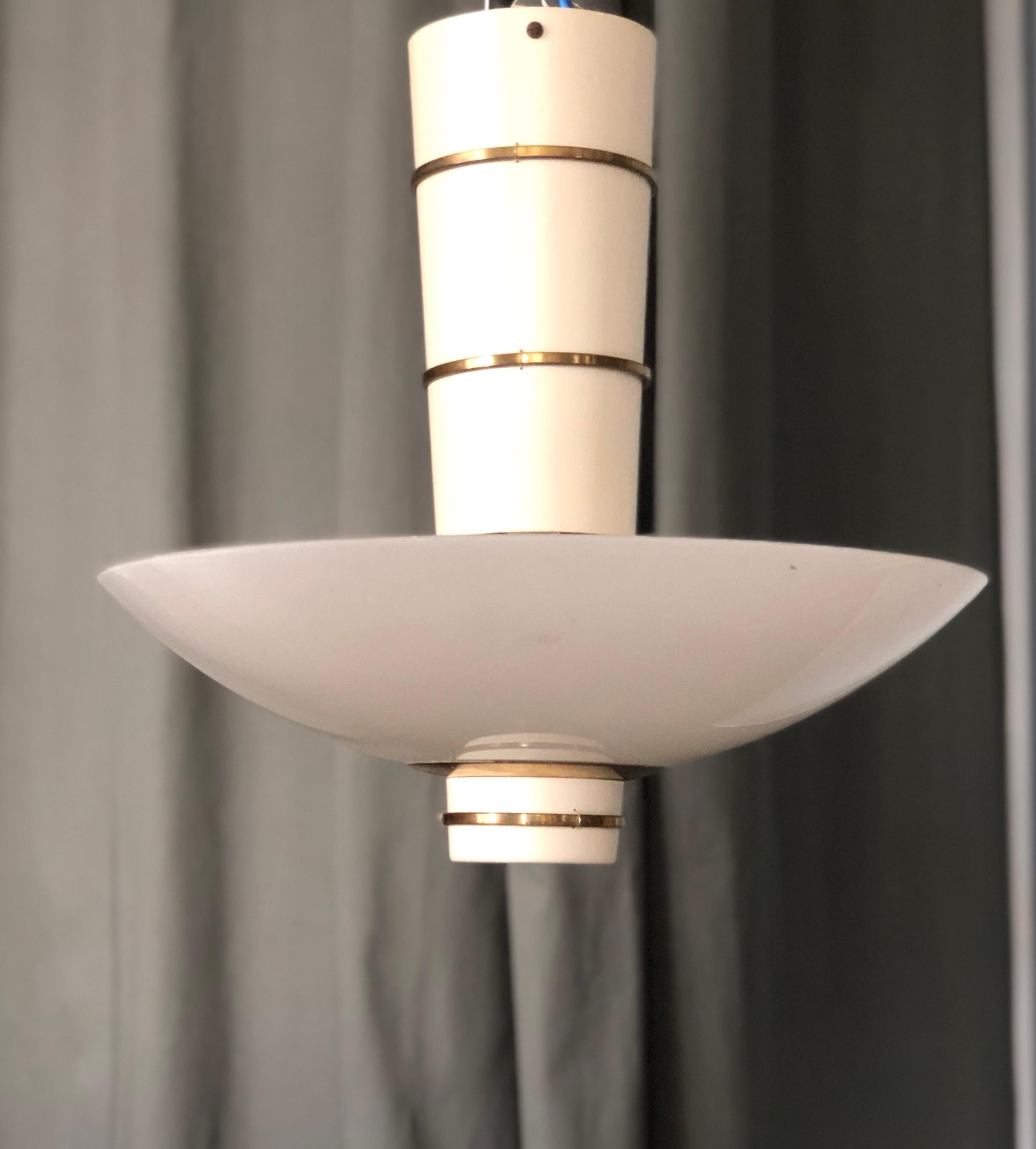 A Ceiling light designed by Paavo Tynell for Taito Oy, Finland, Circa 1940th. Model 9053. Marked by manufacturer.
Recently rewired with 3 porcelain sockets. The paint surface restored with original patina on brass parts.
