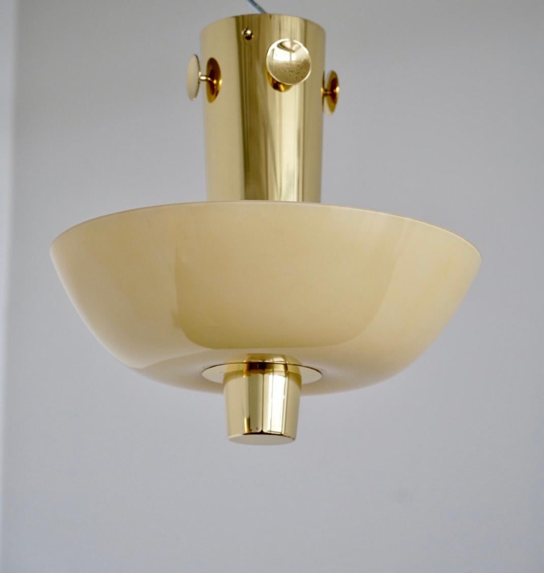 Rare available Model 9052, designed by Paavo Tynell for Taito/ Idman. Finland, Circa 1950th. Polished brass with opaline glass shade and 3 Edison socket bulbs.
Similar model featured at Idman catalogue.
Newly re-polished and waxed. Rewiring