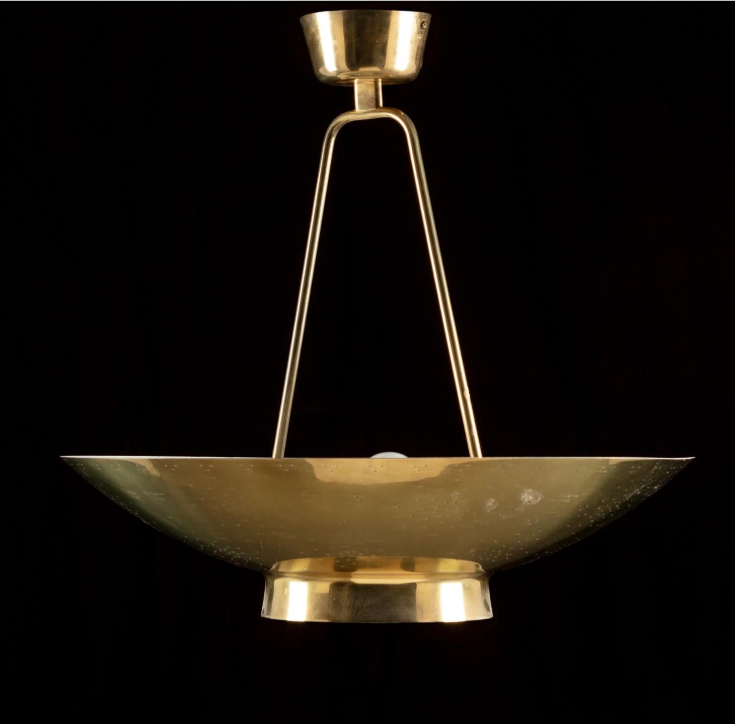 A ceiling light designed by Paavo Tynell for the UN Secretary-General's office, Model 9060. Manufactured by Idman, Finland, Circa 1950th.
Perforated polished brass, 4 sockets. Marked by manufacturer.
The Net price included UL listed rewiring.