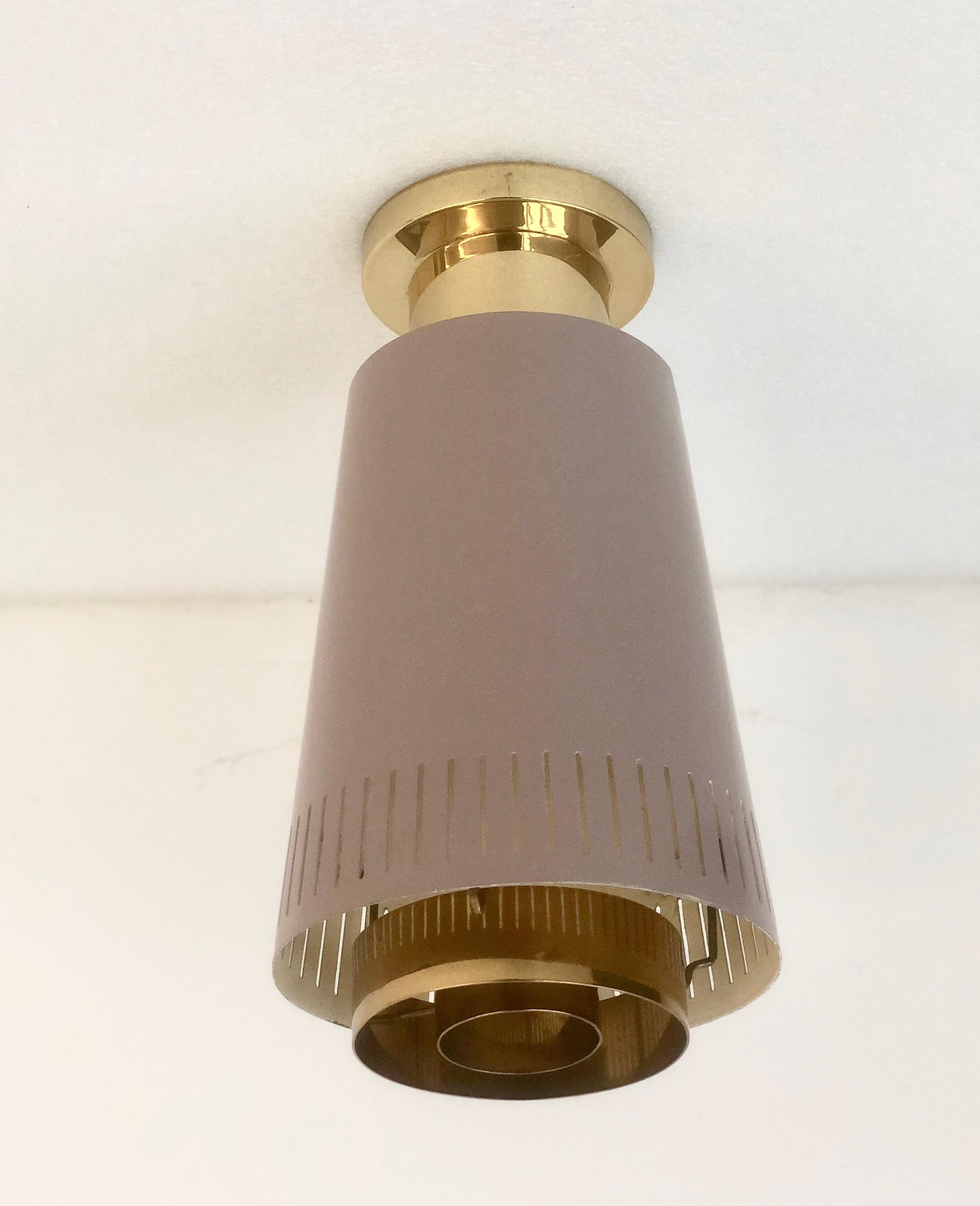 Flush mount ceiling light designed by Paavo Tynell, Model 9067, manufactured by Taito Oy, Circa 1950th.
Painted metal with polished brass base and defusers.
 Similar example featured at Idman Catalogue.
Existing wires, rewiring available upon