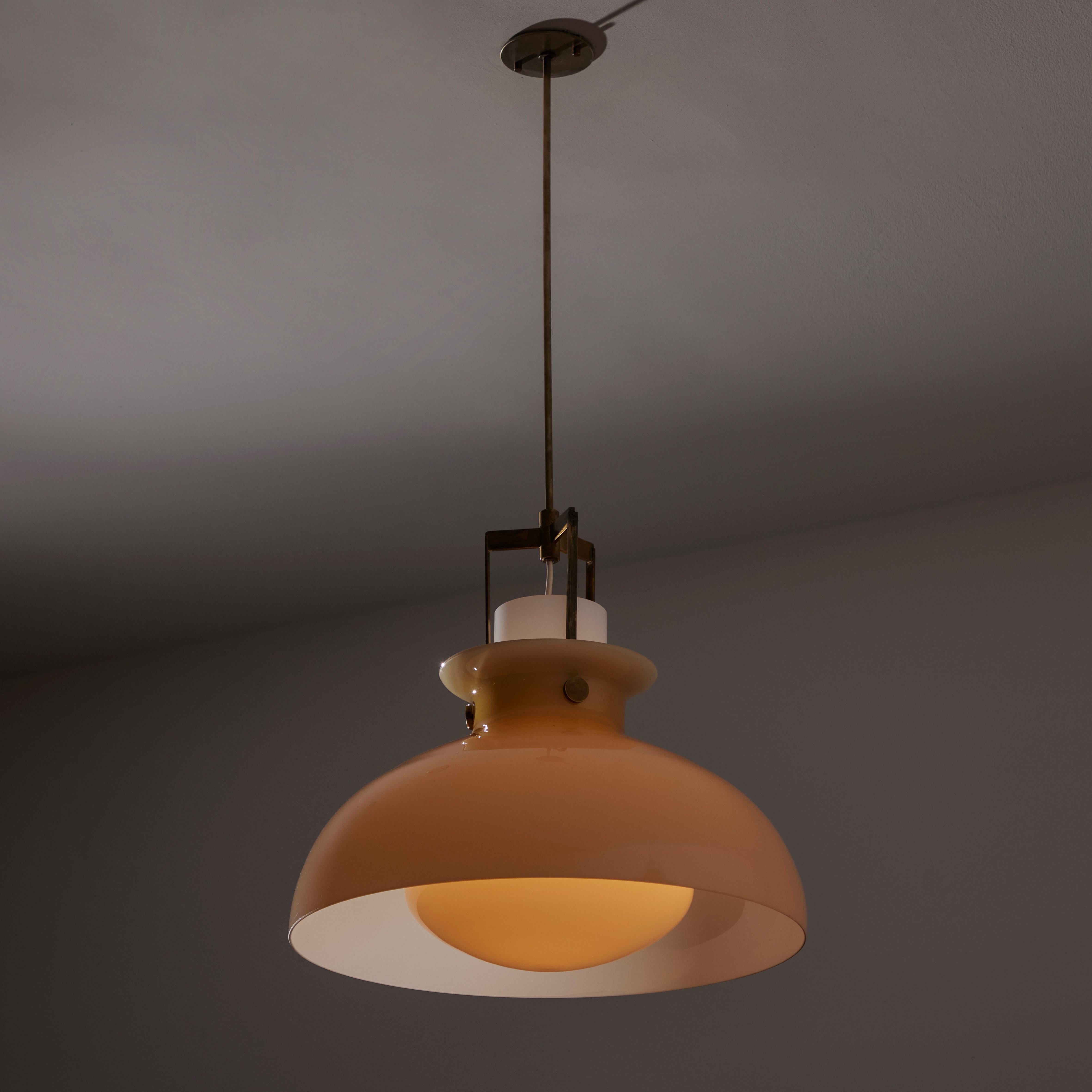 Ceiling light by Paolo Caliari for Venini. Designed and manufactured in Italy, circa the 1960s. Striking Venini pendant with an exterior mauve colored murano glass shade, encompassing an opal interior shade. The glass components are suspended by a