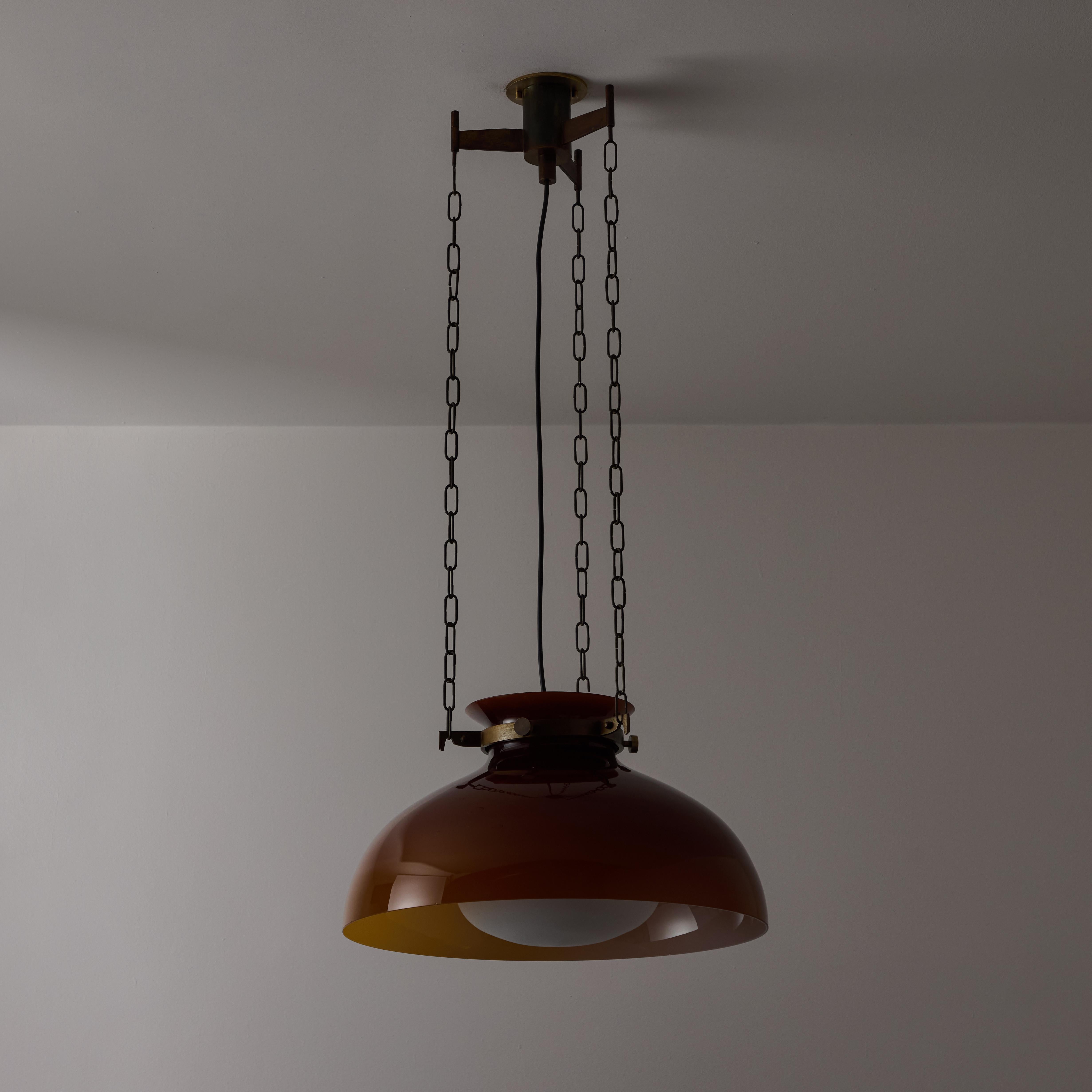 Ceiling light by Paolo Caliari for Venini. Designed and manufactured in Italy, circa the 1960s. Striking Venini pendant with an exterior mauve colored murano glass shade, encompassing an opal interior shade. The glass components are suspended by a