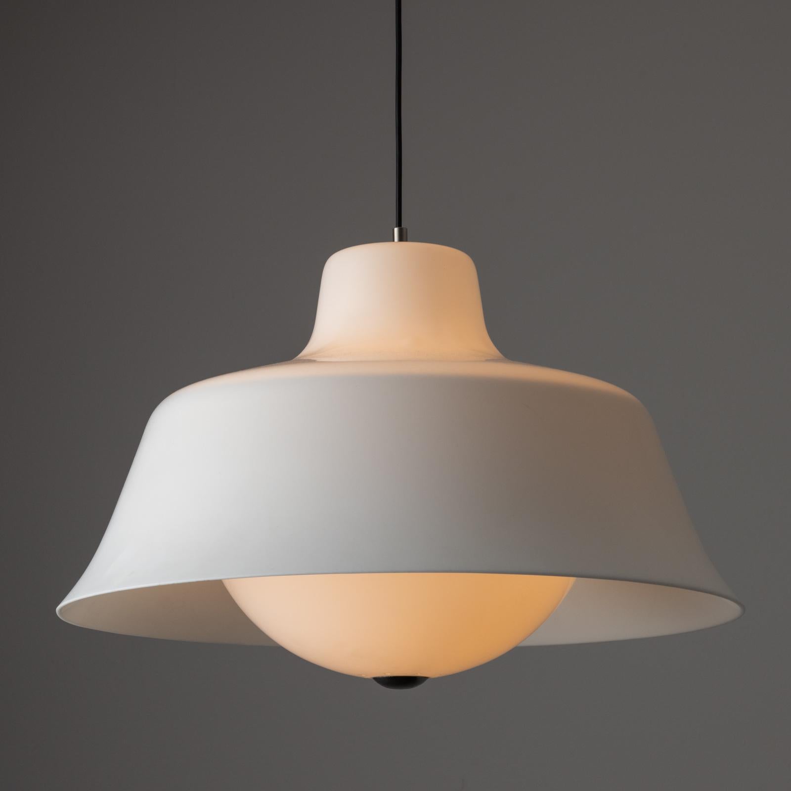 Ceiling Light by Sergio Asti for Kartell. Designed and manufactured in Italy, circa 1960. White acrylic suspension lamp with bell shaped shade and brass detailing. The lamp holds one E27 bulb socket, adapted for the US. We recommend using a 40w