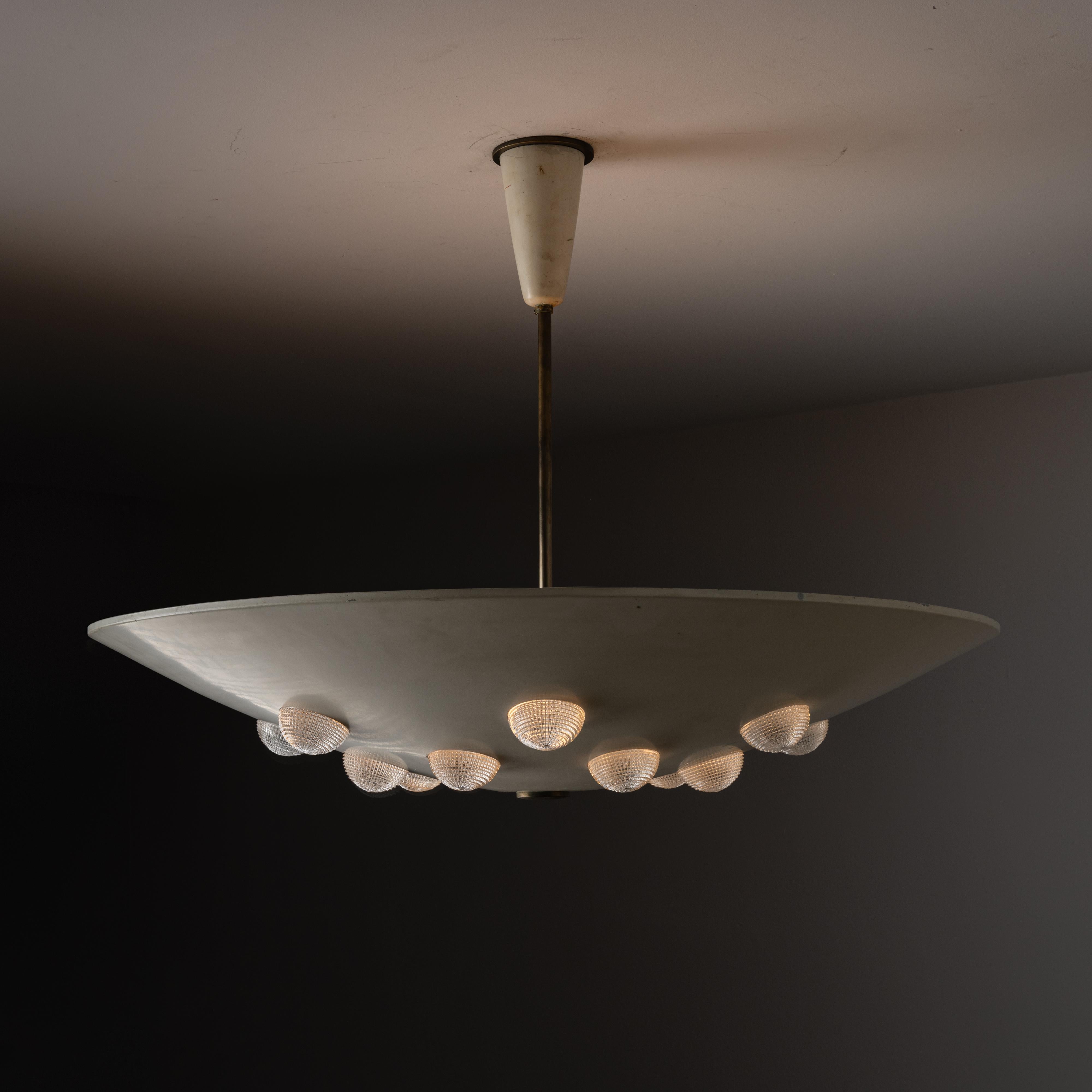 Ceiling Light by Stilnovo. Designed and manufactured in Italy, circa the 1960s. A large enameled dish in a bone color. The dish has stamped circles all around, allowing for small texturized glass lenses to sit in them for light diffusion. This light