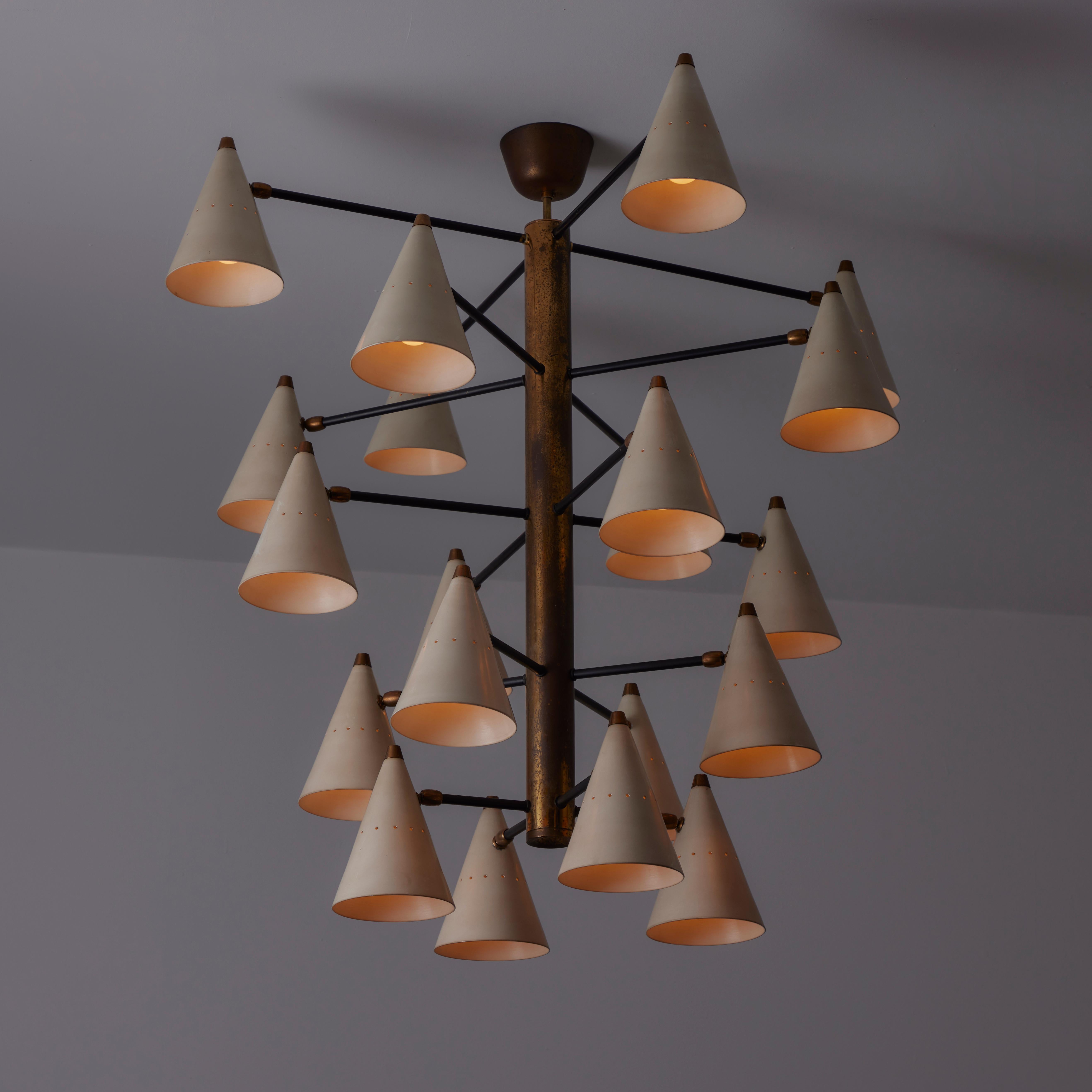 Ceiling Light by Stilnovo. Designed and manufactured in Italy, circa the 1950s. Conical enameled shades cascade down a heavy brass tube suspension. Stunningly gothic large-scale chandelier. The lamp consists of 22 shades, each housing a single E27