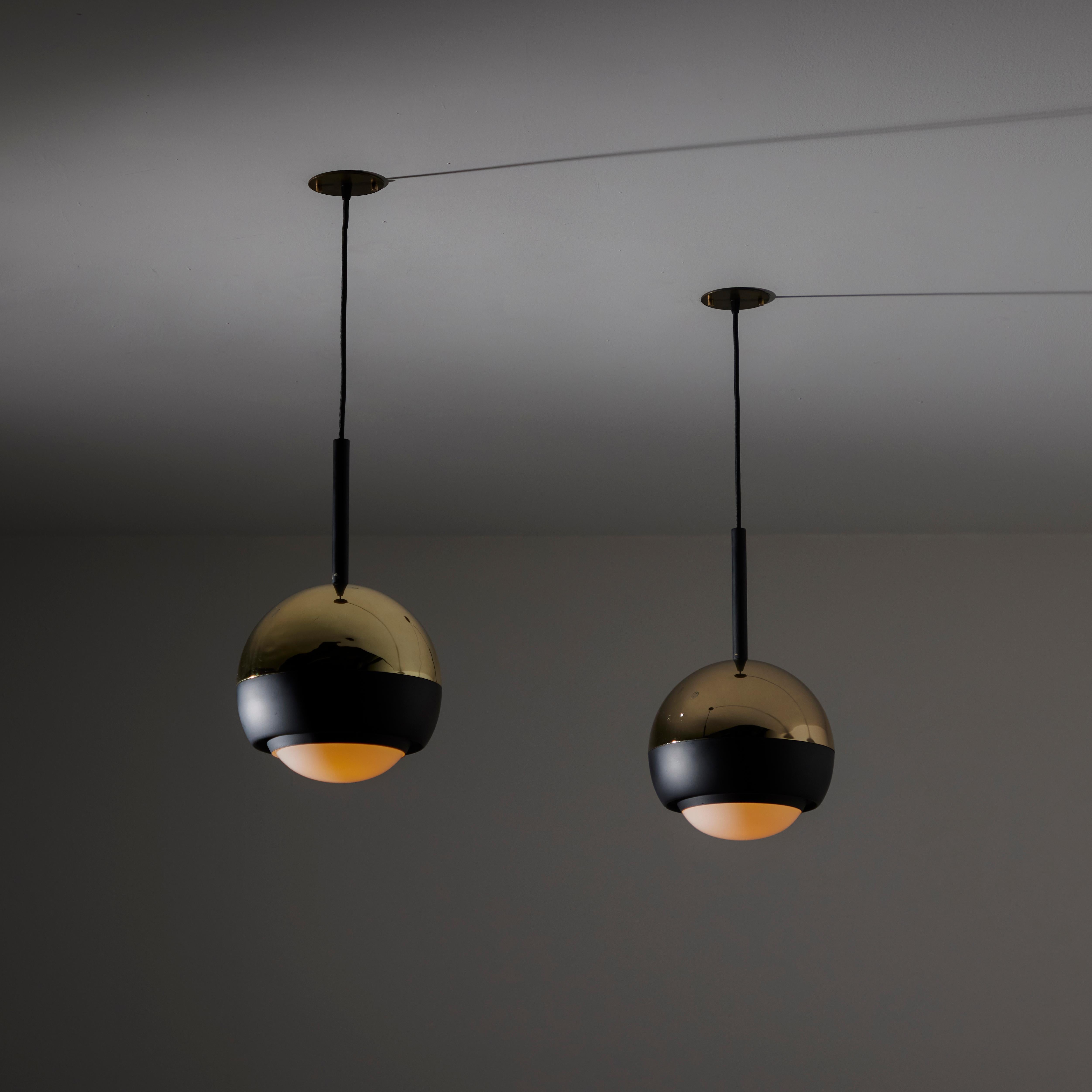 Ceiling Light by Stilnovo. Designed and manufactured in Italy, circa the 1960s. Original model 1230 pendants from Stilnovo. The glass diffusers have been replaced by opaline diffusers. The lamps comprise of black enameled coating and polished brass.