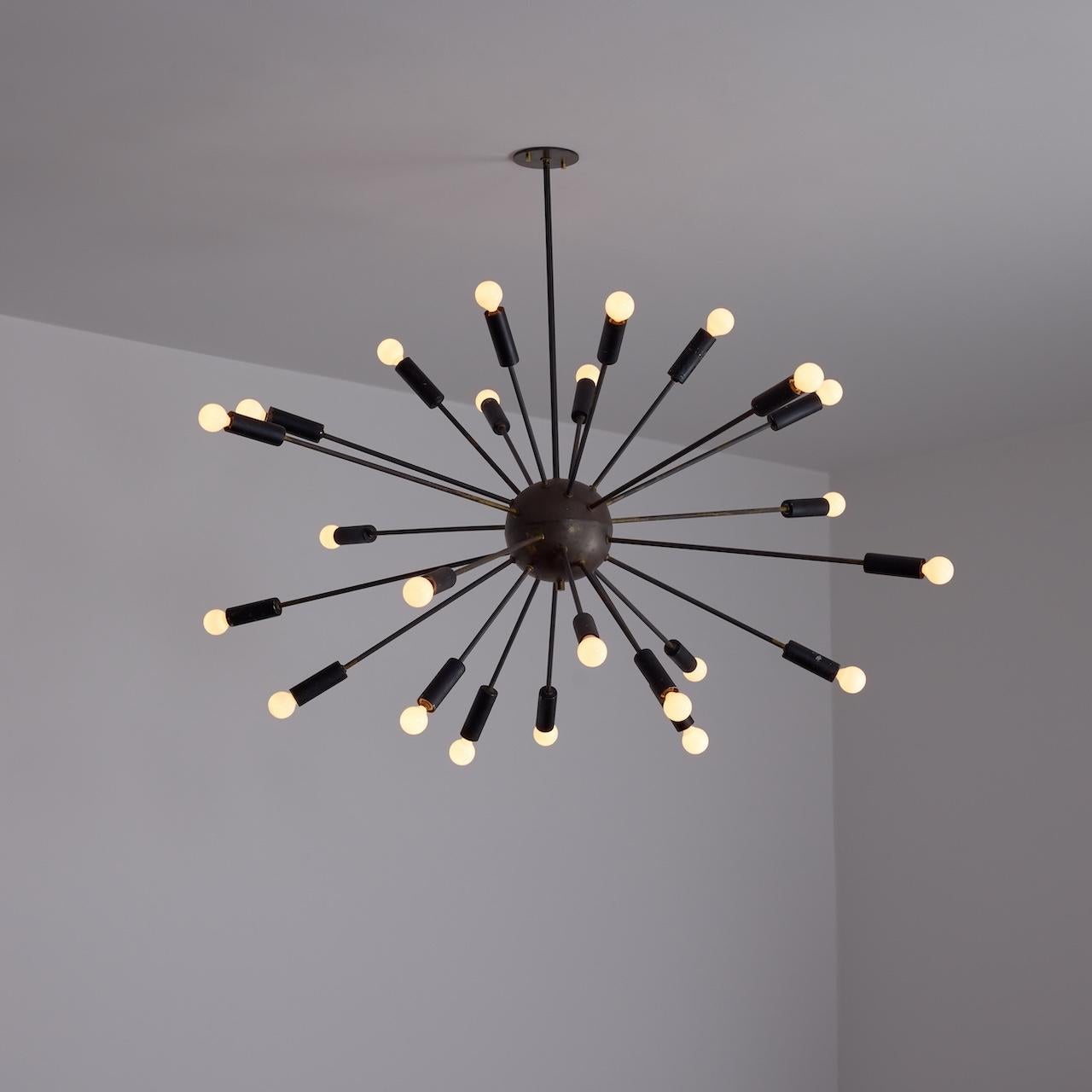 Ceiling Light by Stilnovo (IT, c. 1960s)

Sputnik chandelier with most of the construction in brass, with heavy patina throughout, and socket coverings in black enamel. Each socket is an e14 base, adapted for the US. We recommend a 25w - 40w max