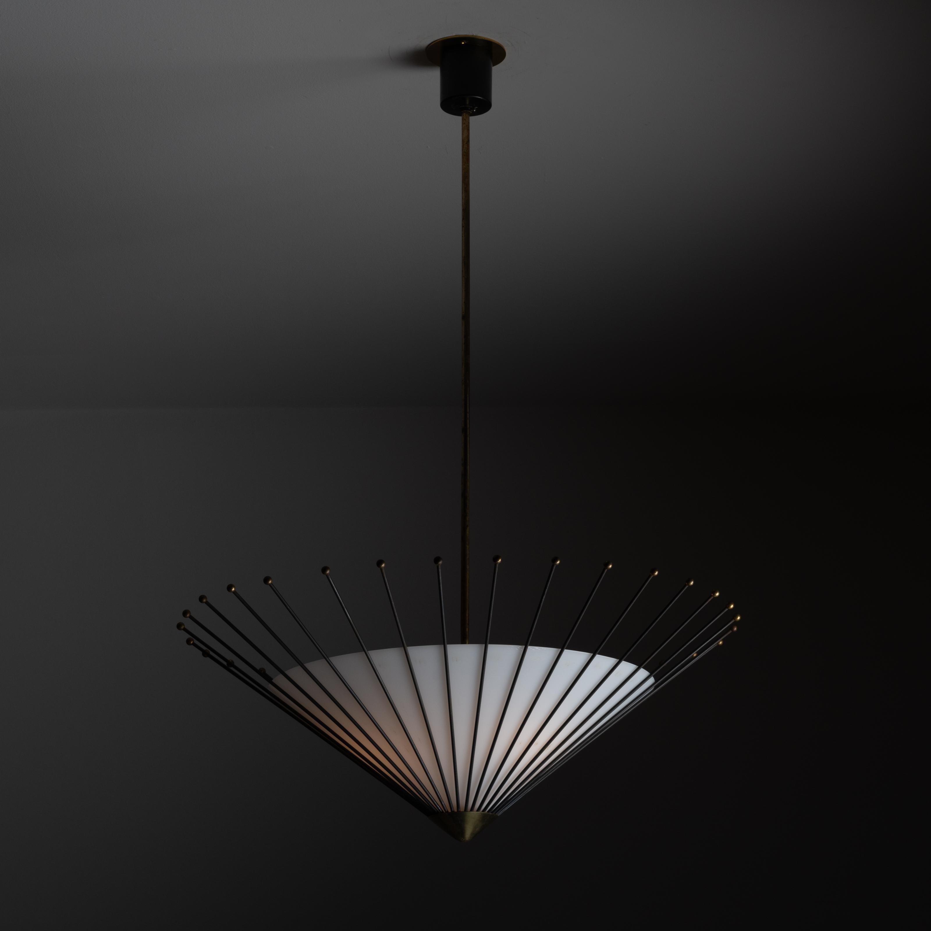 Ceiling light by Stilux. Designed and manufactured in Italy, circa 1960's. Opal glass diffuser. Enameled rod incasement for a striking look from all angles. Shade is suspended by a solid brass polished stem. Custom brass backplate. Wired for U.S.