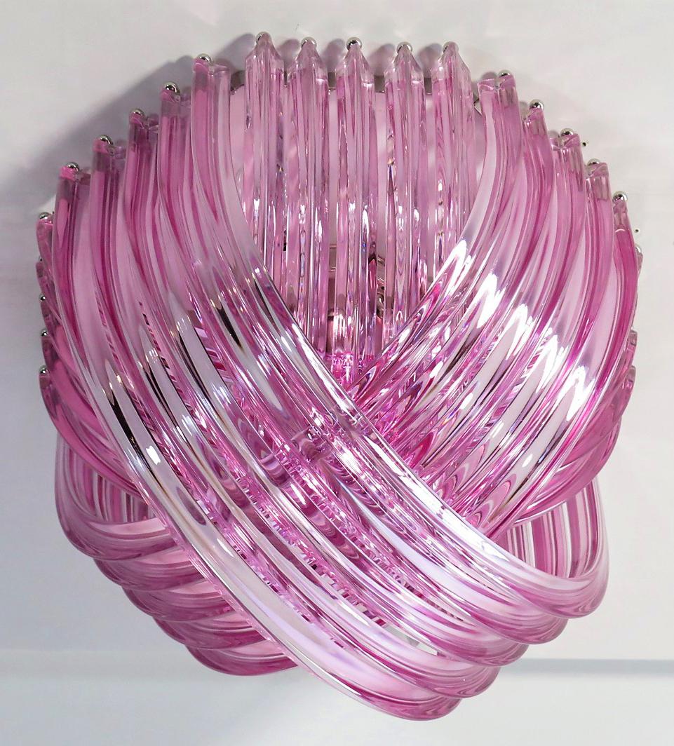 Murano light pink glass chandelier or ceiling light with four layers of curving “triedri” glass prisms on an octagonal chrome structure. A dynamic form, changing as you move around it, due to the overlapping levels of transparent glass with light