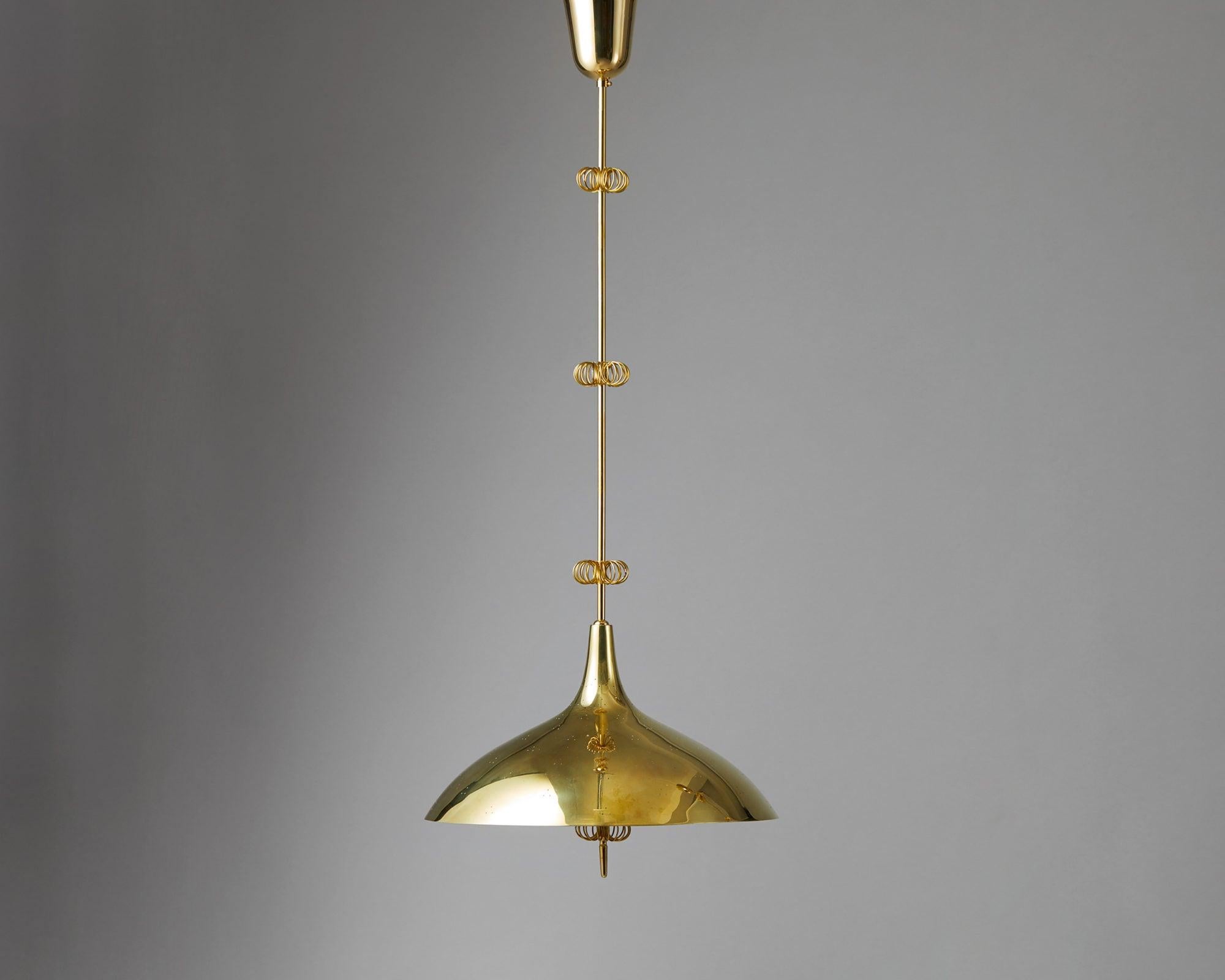 Ceiling light designed by Paavo Tynell, Finland, 1950s. 

Pierced brass with glass.

Measurements:
H: 105 cm/ 3' 5 1/3