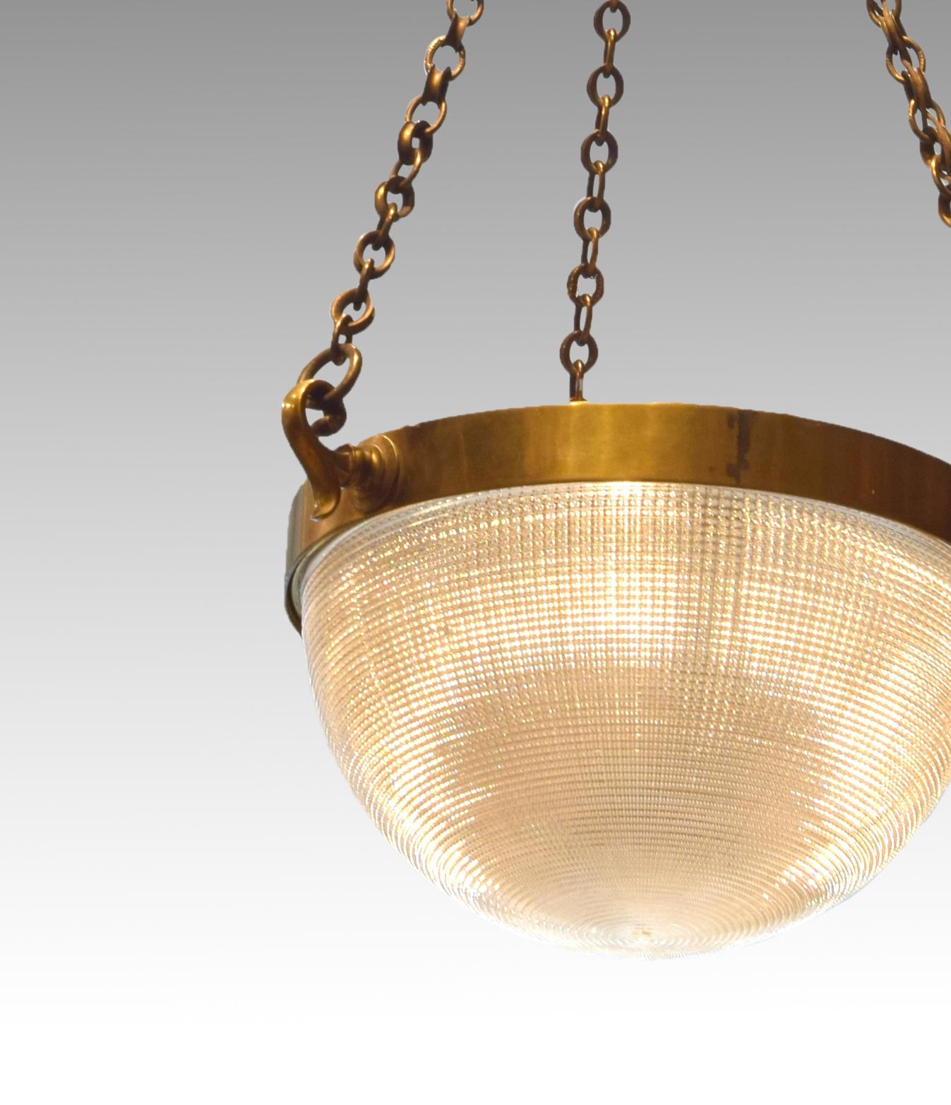 Ceiling lamp. Metal, glass, 20th century.
Ceiling lamp made up of a circular piece for the ceiling from which a chain hangs to a piece made up of a ring and a sphere, from which three other chains that support the lamp, consisting of another smooth