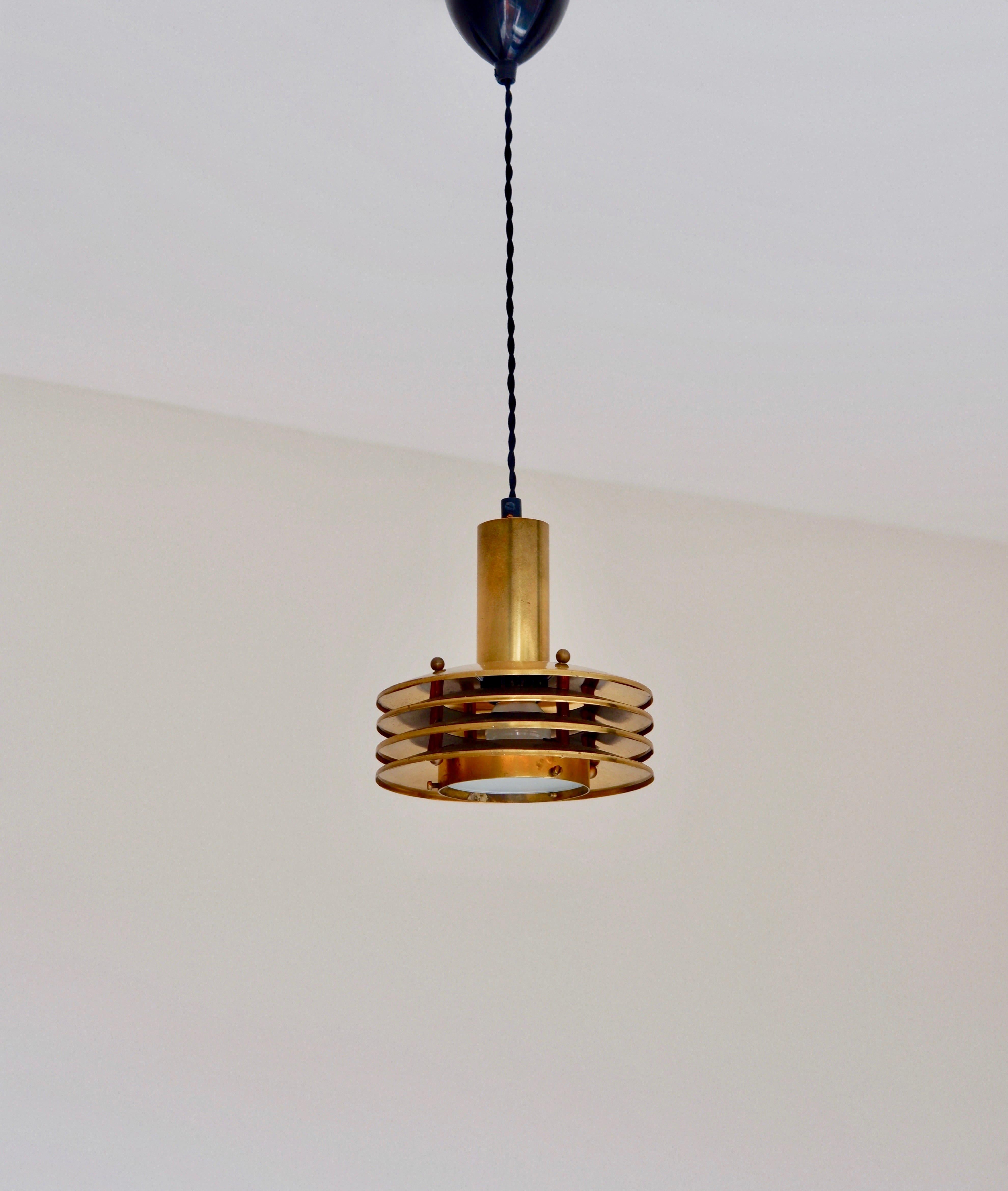 Scandinavian Modern Ceiling light in brass designed by Kari Ruokonen circa 1960.