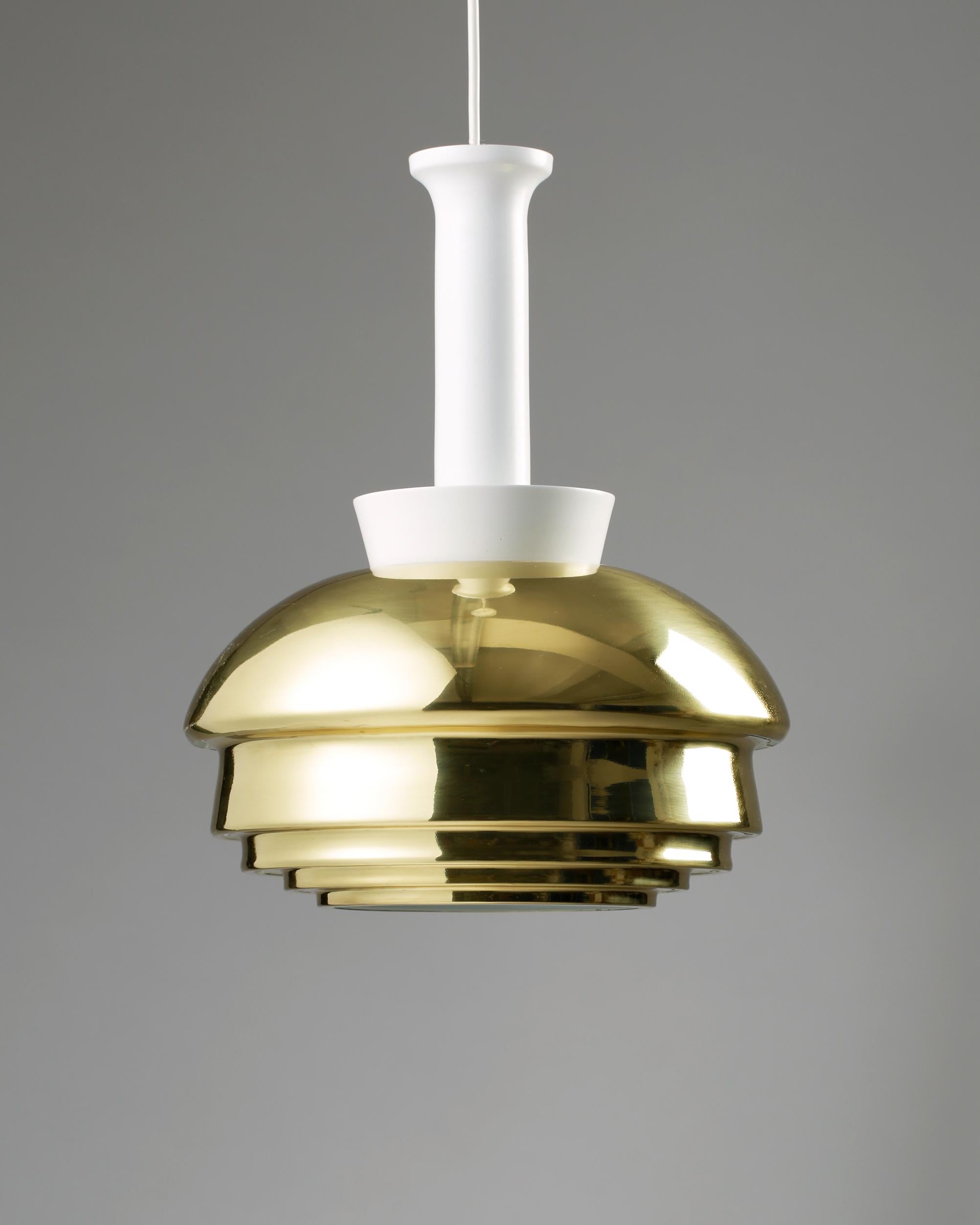 Ceiling light model A 335 designed by Alvar Aalto for Valaisinpaja Oy,
Finland. 1952.
Brass and lacquered metal.

Measurements: 
Height of the shade: 40 cm/ 15 3/4''
Total height: 65 cm/ 25 1/2''

Alvar Aalto was a Finnish architect and designer.