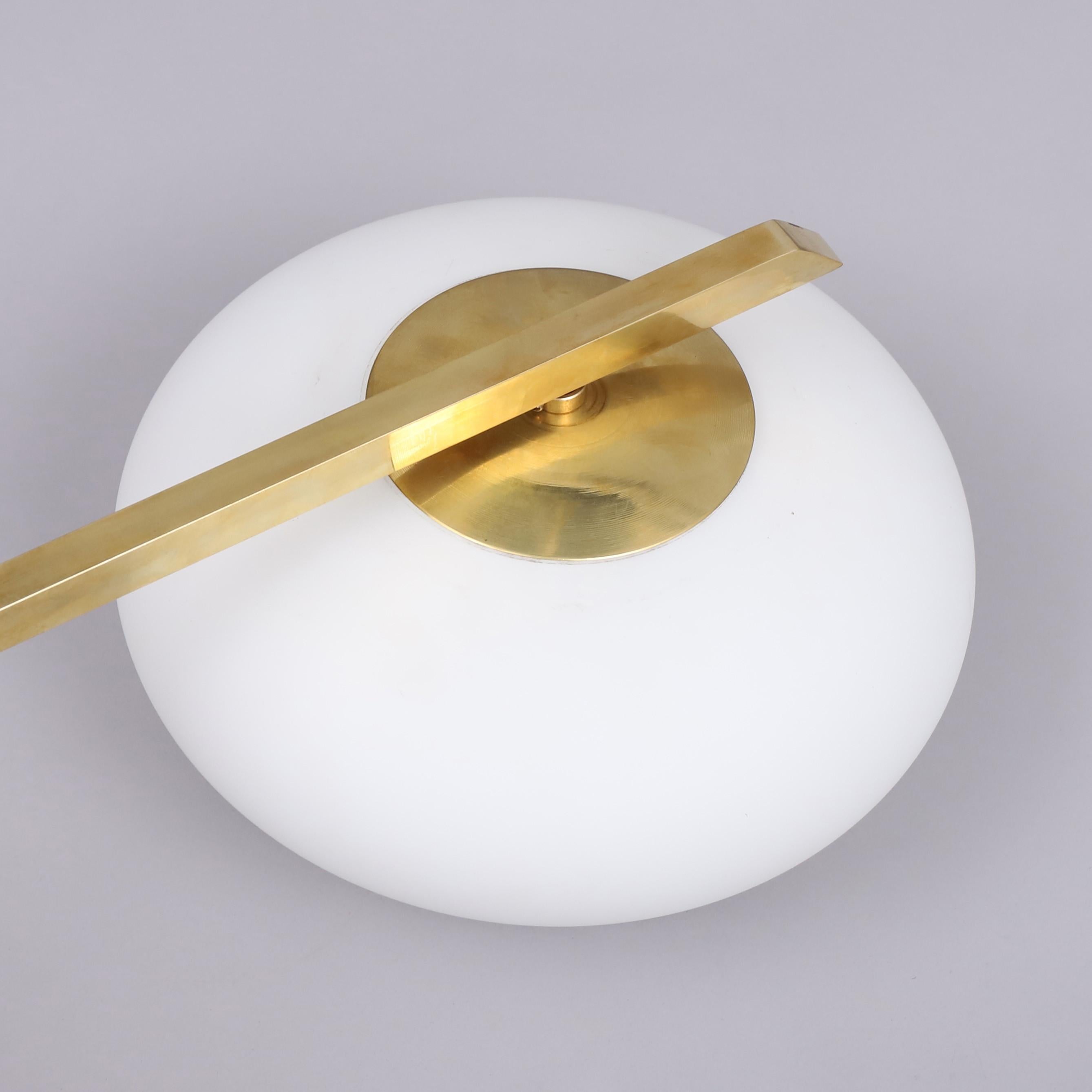 Ceiling light wall light  in the style of  Angelo Lelli For Arredoluce  a recent edition made in Italy  circa 1990/2000
This model can be use as a ceiling lamp or a wall light.
Made of brass and 2 opalin white glass to hide the bulbs.
Good condition.