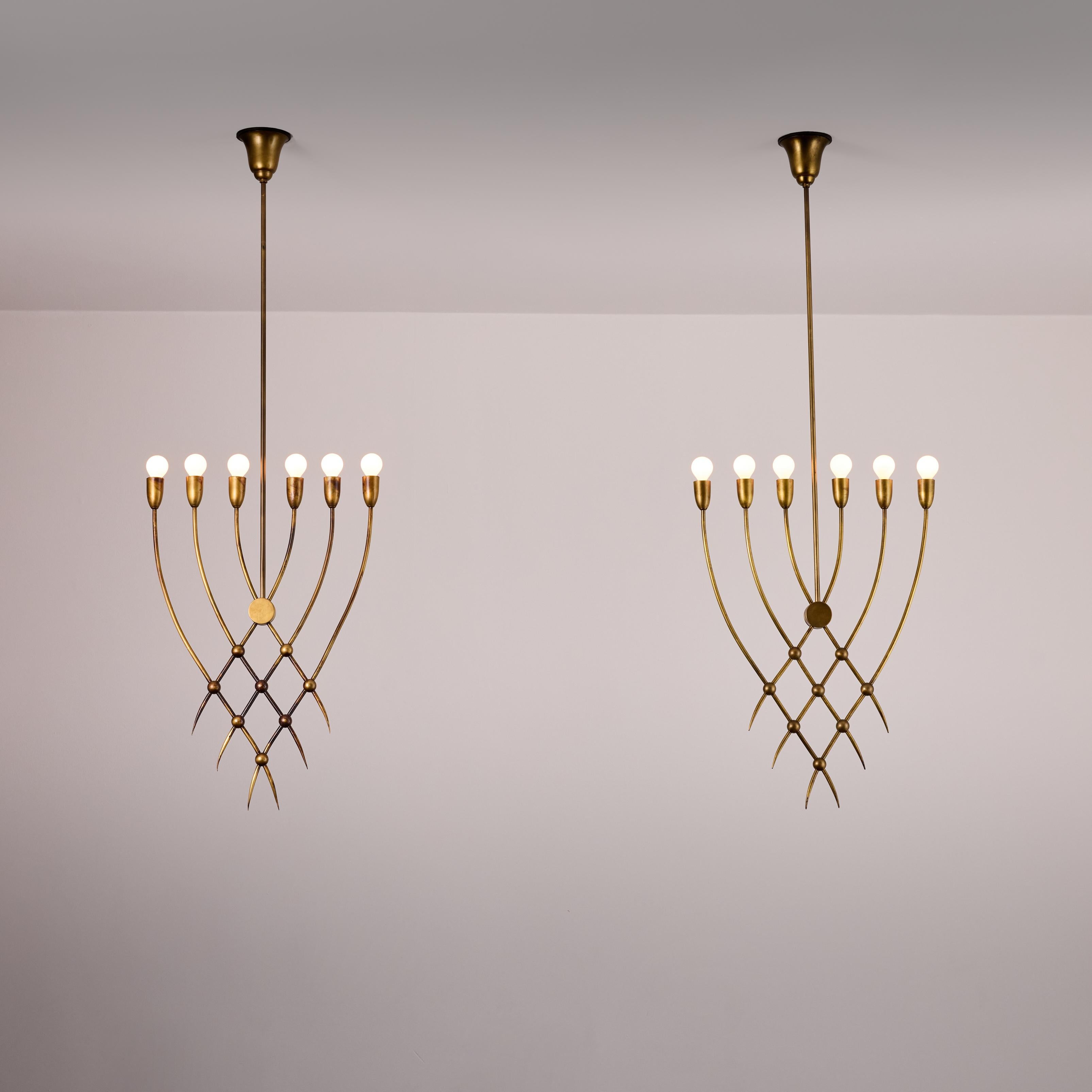 Ceiling Light by Guglielmo Ulrich. Designed and manufactured in Italy, circa the 1940s. Beautiful cross-hatched brass stems, making up a slim planed chandelier. Each chandelier holds six candelabra sockets, adapted for the US. We recommend 25-40w
