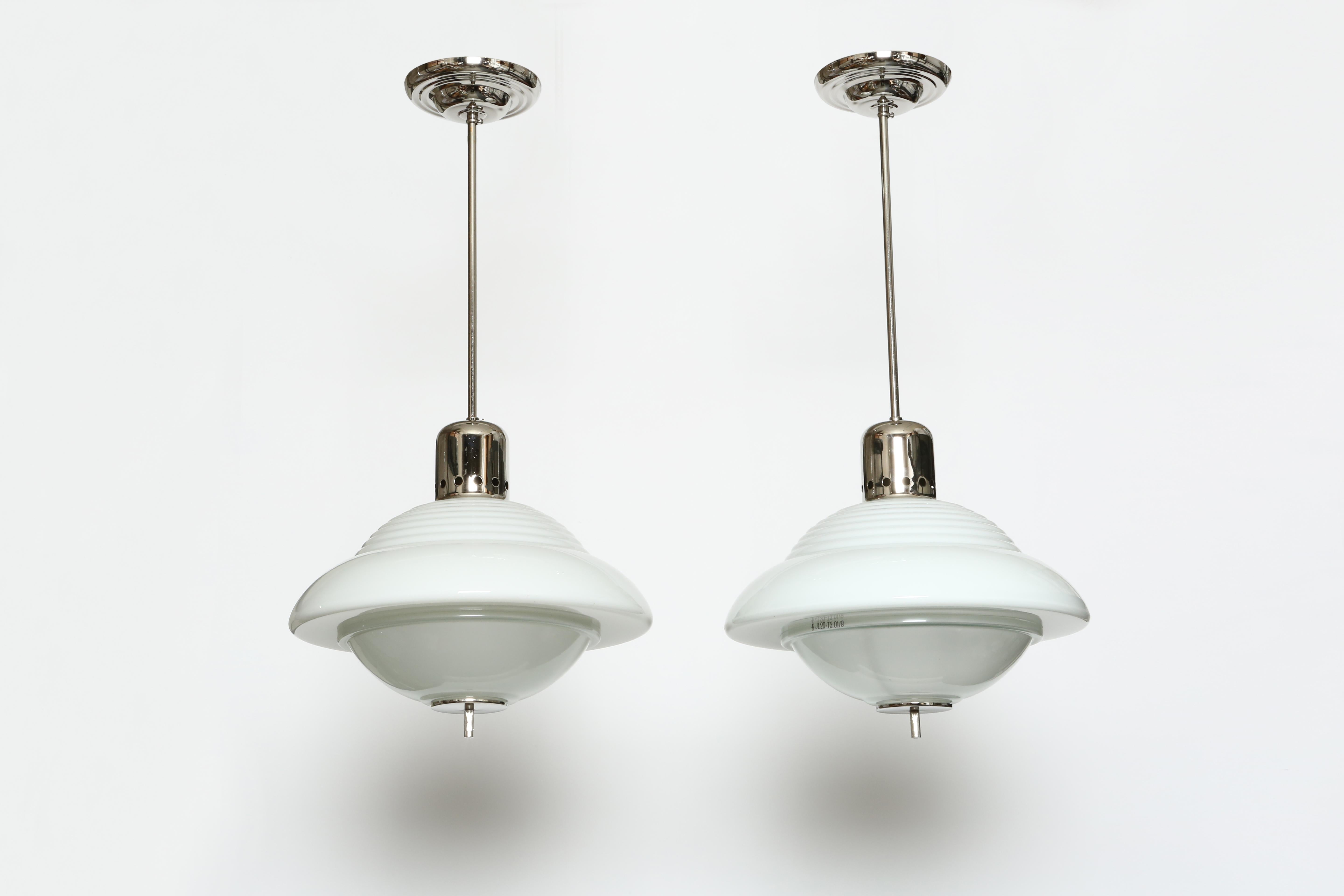 Ceiling lights by Siemens, a pair.
Made in Germany 1940s.
Model JL20-T3
Opaline and acid etched glass, nickel plated steel.
