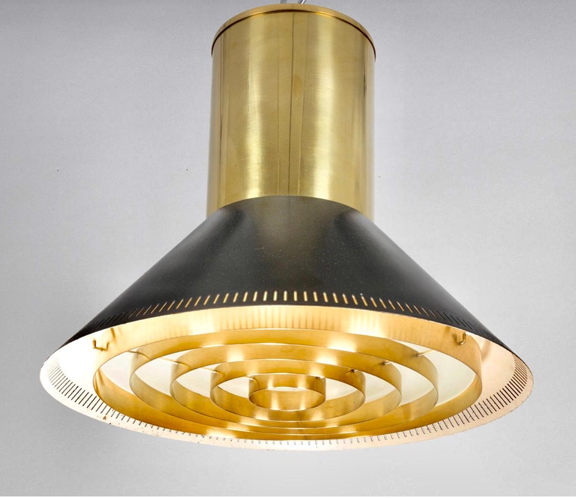 A Ceiling mount light designed by Paavo Tynell for Taito Oy, Finland, Circa 1950th.
Polished brass and painted metal. Marked Taito.
Rewiring available upon request.