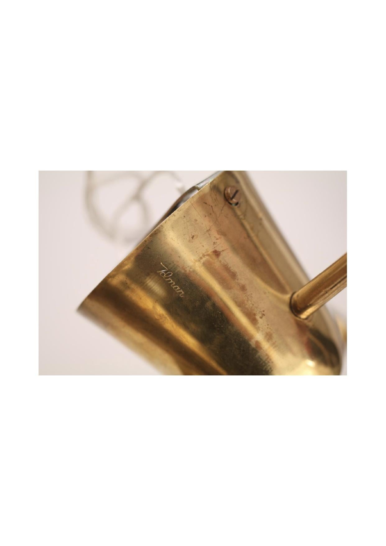 Ceiling lamp Model “ K2-48” 
Manufactured by Idman. 
Finland, 1958.
Brass Lampshade

Measurements:
96 h cm (adjustable)
Each cone: 10,5cm x 33 h cm.

Literature:
Idman Catalog N 142, Finland, 1958 p 92.

Details:
Signed with manufacturer’s mark to