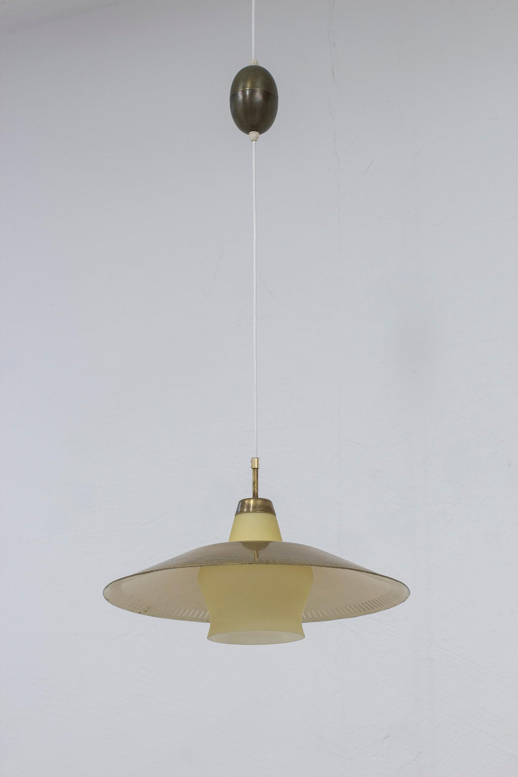 Scandinavian Modern Ceiling pendant light in brass, glass by Harald Notini, Böhlmarks, Sweden, 1940s For Sale