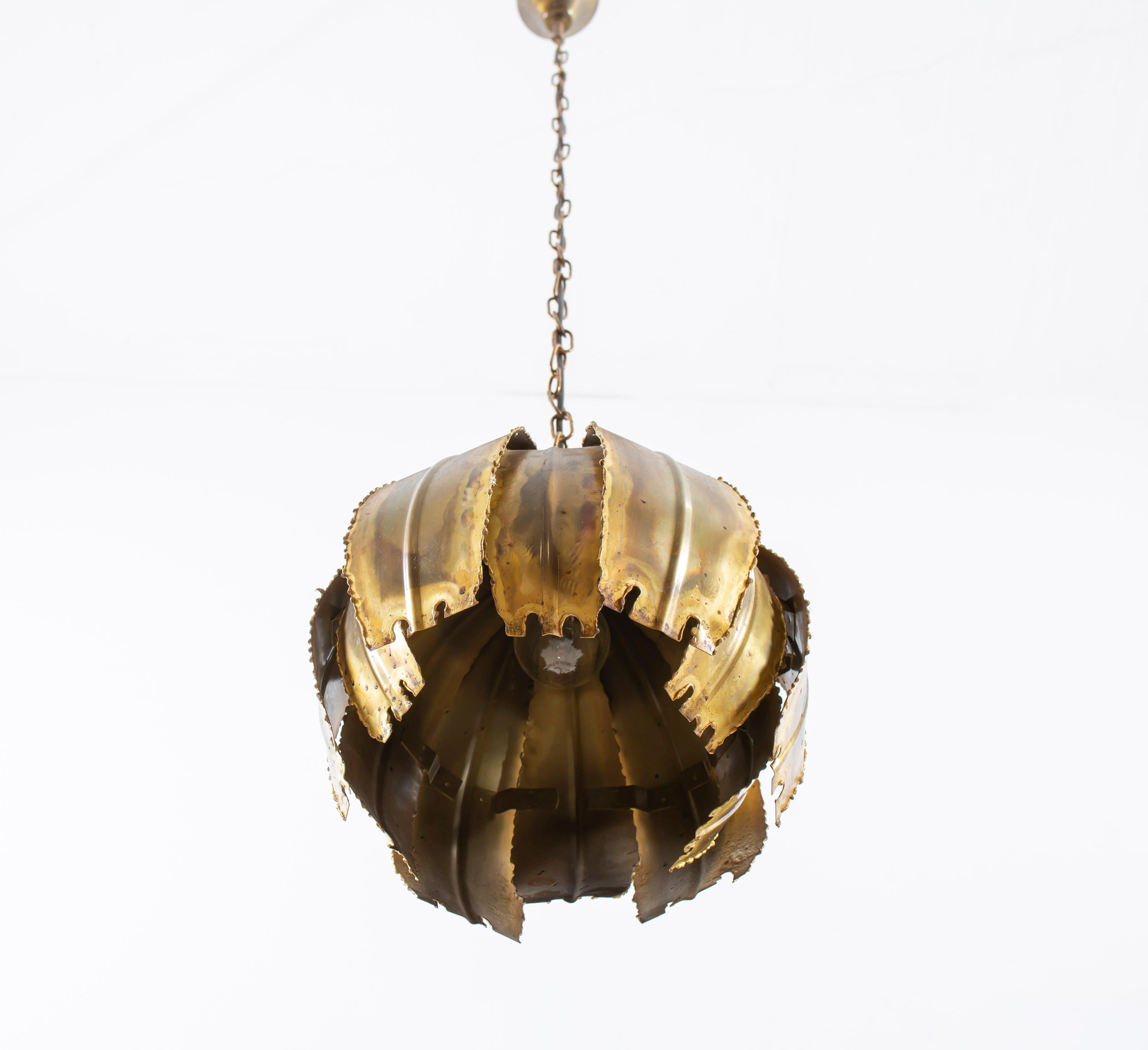 Decorative and rare ceiling pendant in patinated brass. This is model 'Poppy'. Designed by Svend Aage Holm and made in Denmark by Holm Sørensen from circa 1970s second half. The pendant is fully working and in a very good vintage condition. The lamp