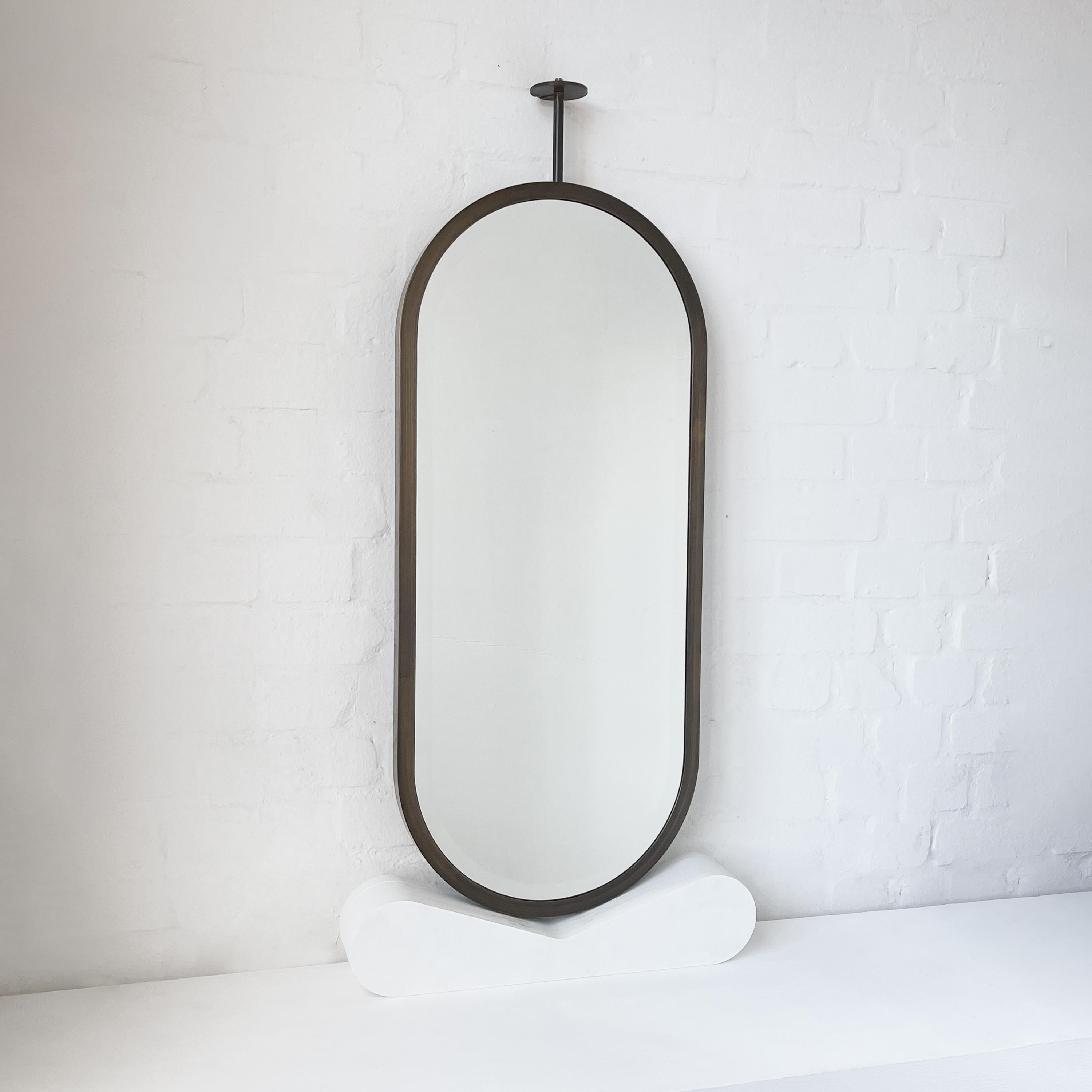 Beveled Ceiling Suspended Capsula Pill shaped Bevelled Mirror with Bronze Patina Frame For Sale