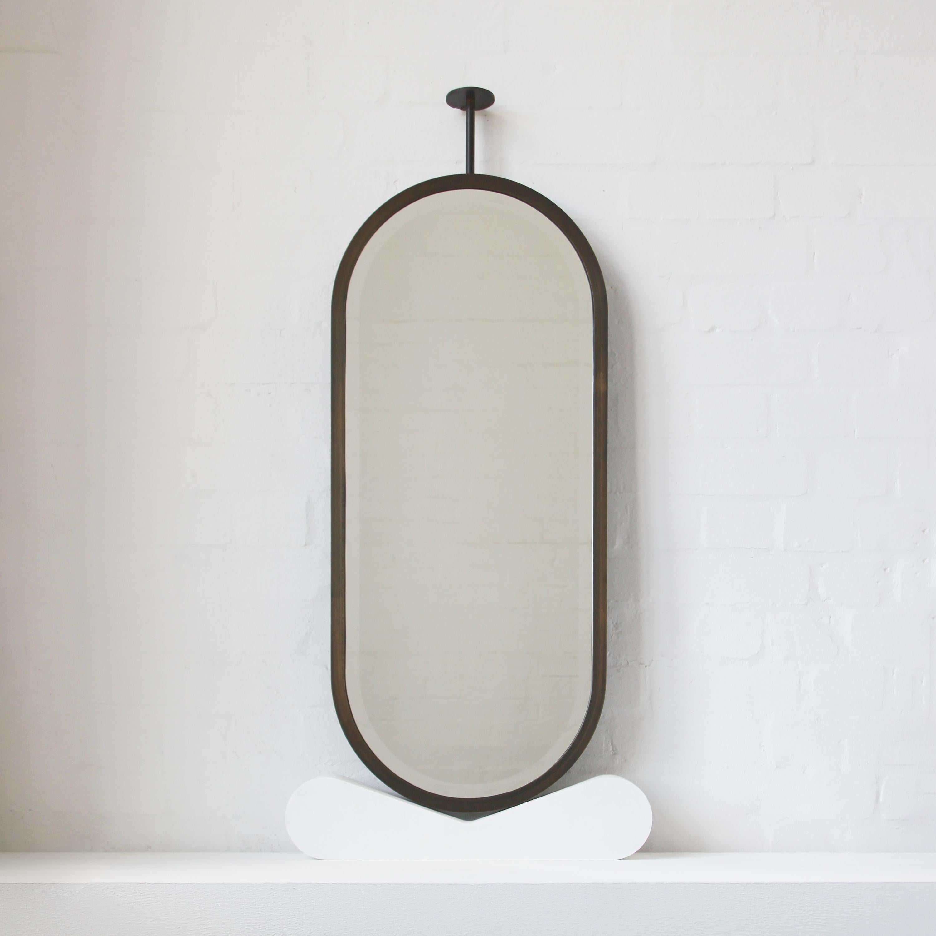 Contemporary Ceiling Suspended Capsula Pill shaped Bevelled Mirror with Bronze Patina Frame For Sale
