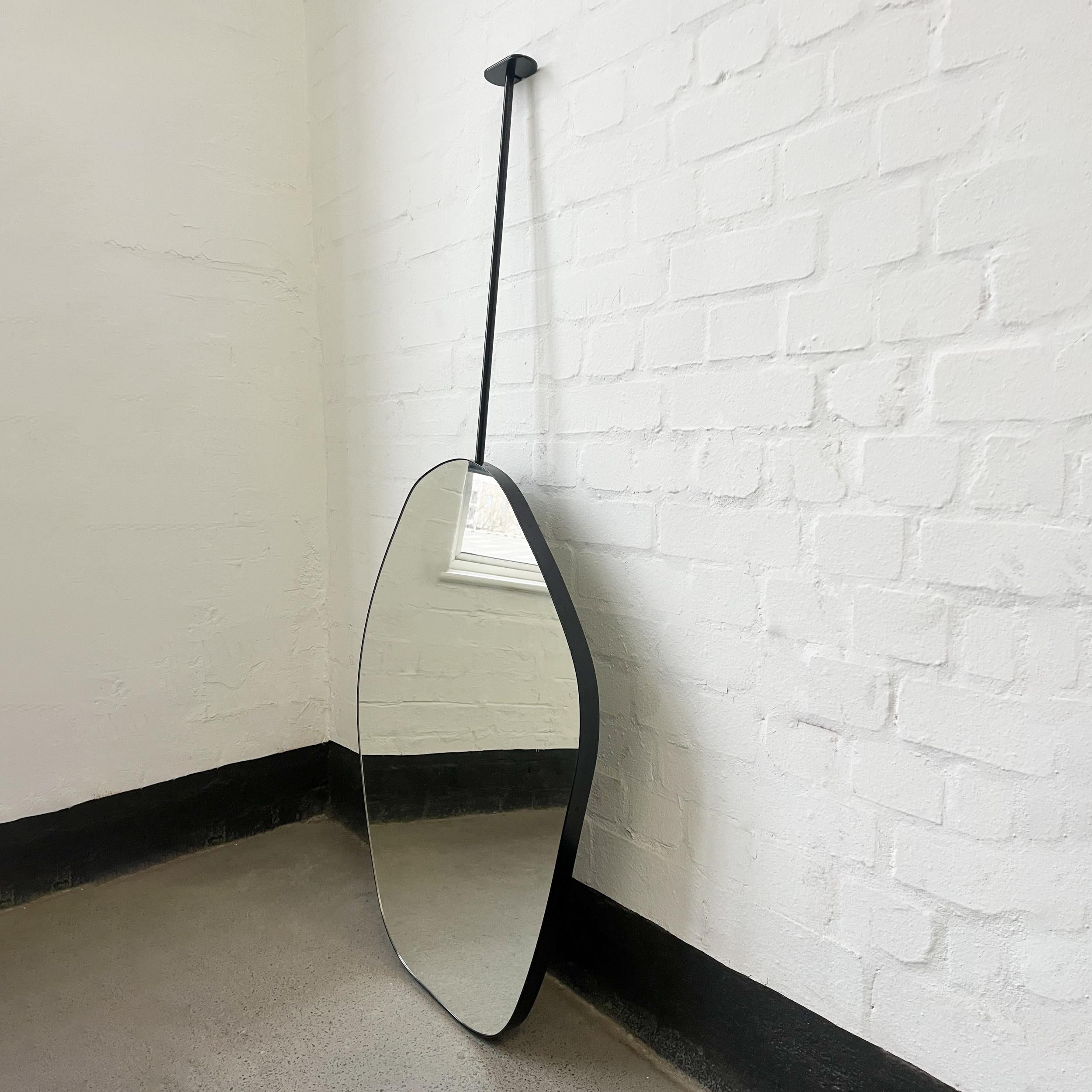 Roca™ modern freeform ceiling hanging suspended mirror with a minimalist aluminium powder coated black frame. Designed and handcrafted in London, UK. This mirror is fully customisable to suit the specific requirements of your interior.

Dimensions