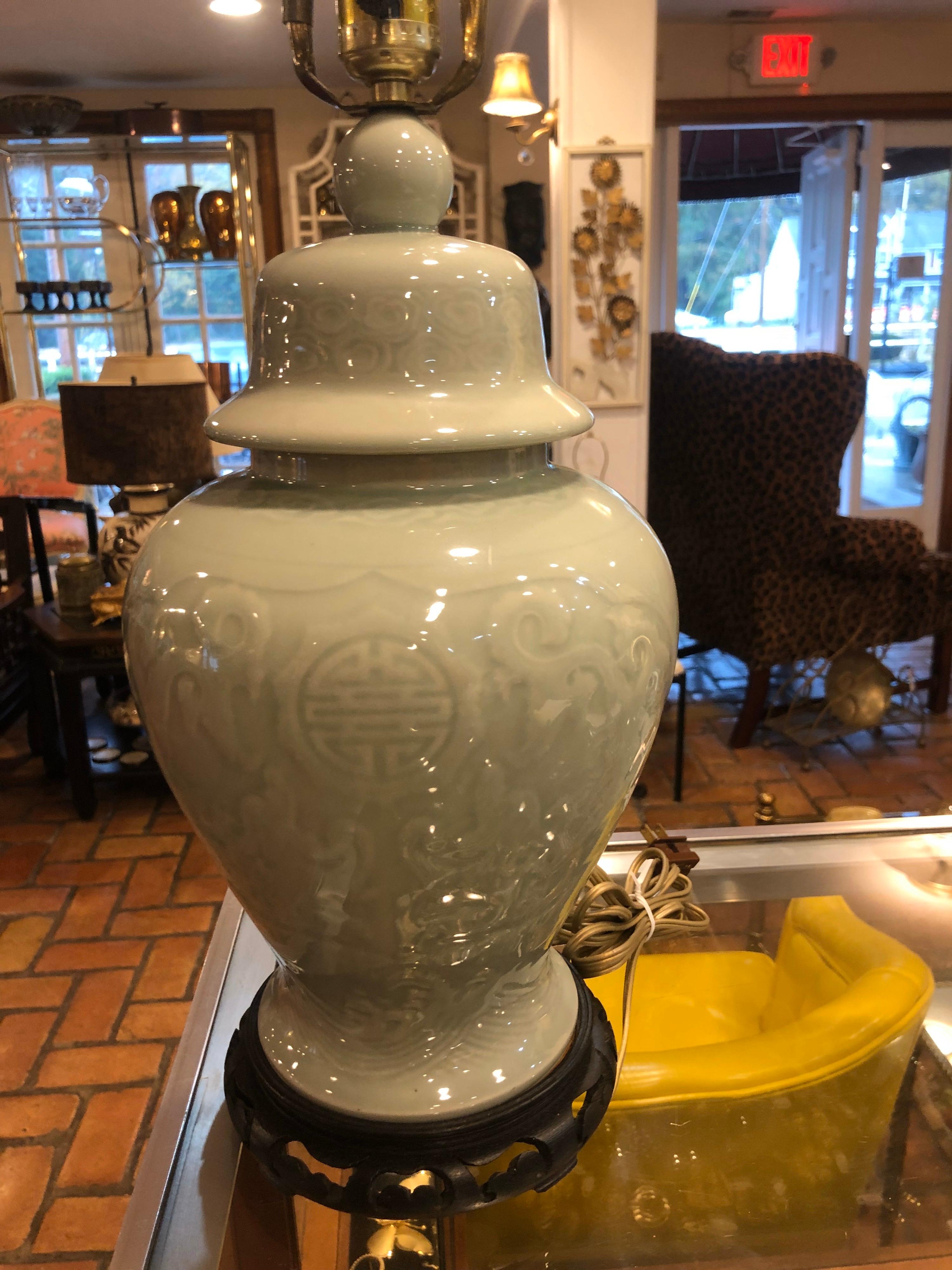 Celadon ginger jar lamp with pierced wooden base. Nice decorative piece for your home. Approximate 28