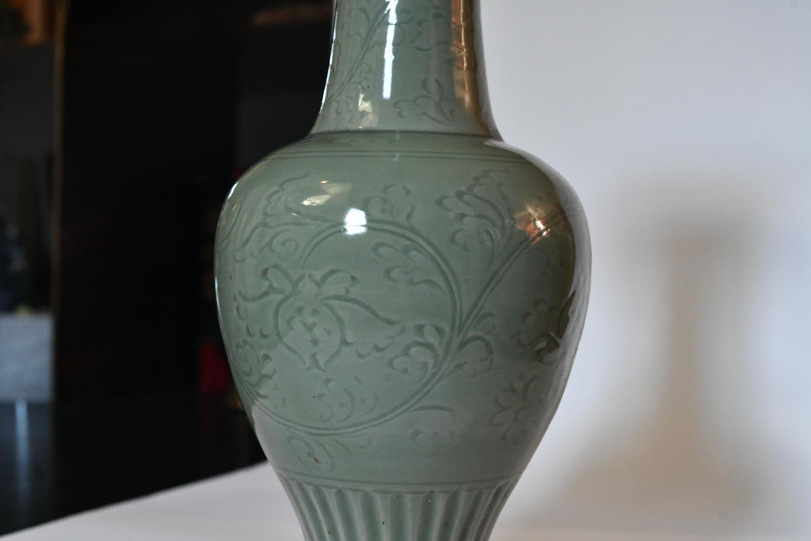 Pair of celadon glazed porcelain vases mounted as lamps.
To the top of porcelain: 19.75