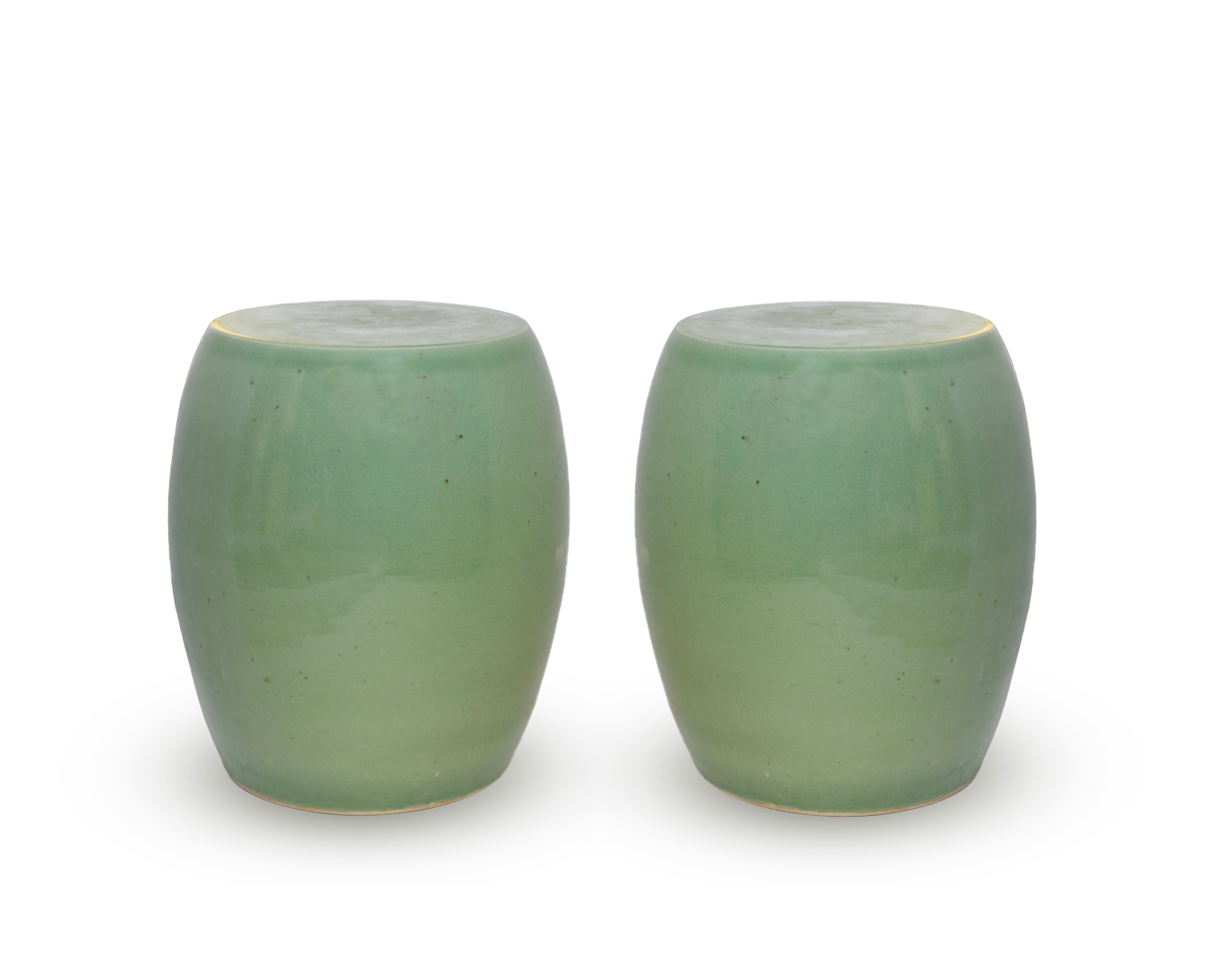 A pair of Celadon Glazed porcelain stools with hair cracks under glaze detail.