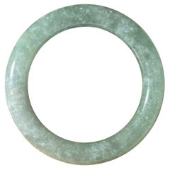 Vintage Celadon Green Mottled Jade Bangle. Weight: 58.7gr. Circumference: 21cm.