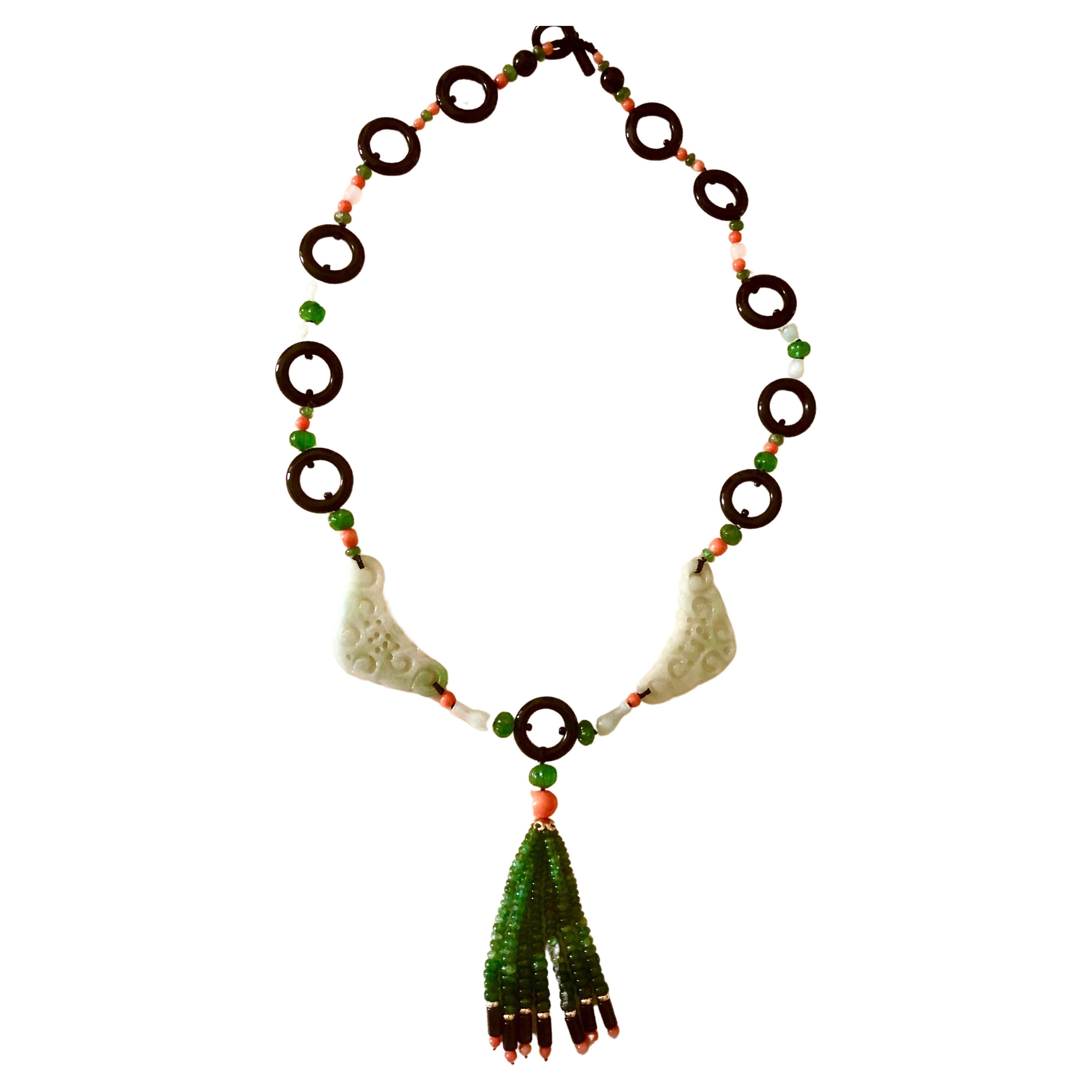 Dramatic necklace in high Art Deco style. In fact many of the elements in the piece were from a partially destroyed period piece including the celadon jade elements. The colored coral was original as well. I took some liberties in what were the