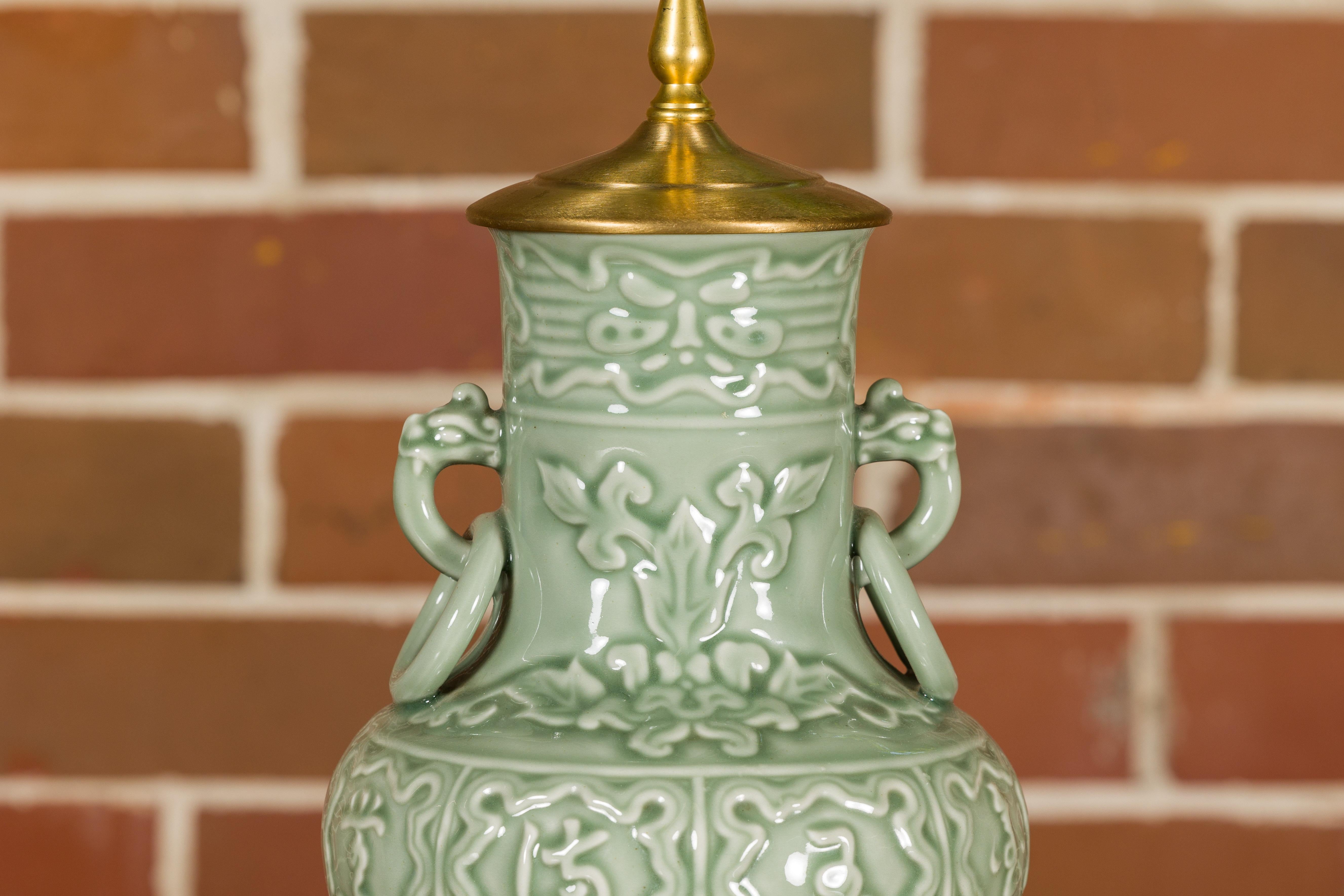 Porcelain Celadon Midcentury Lamp with Raised Motifs on Circular Gilt Base, USA Wired For Sale