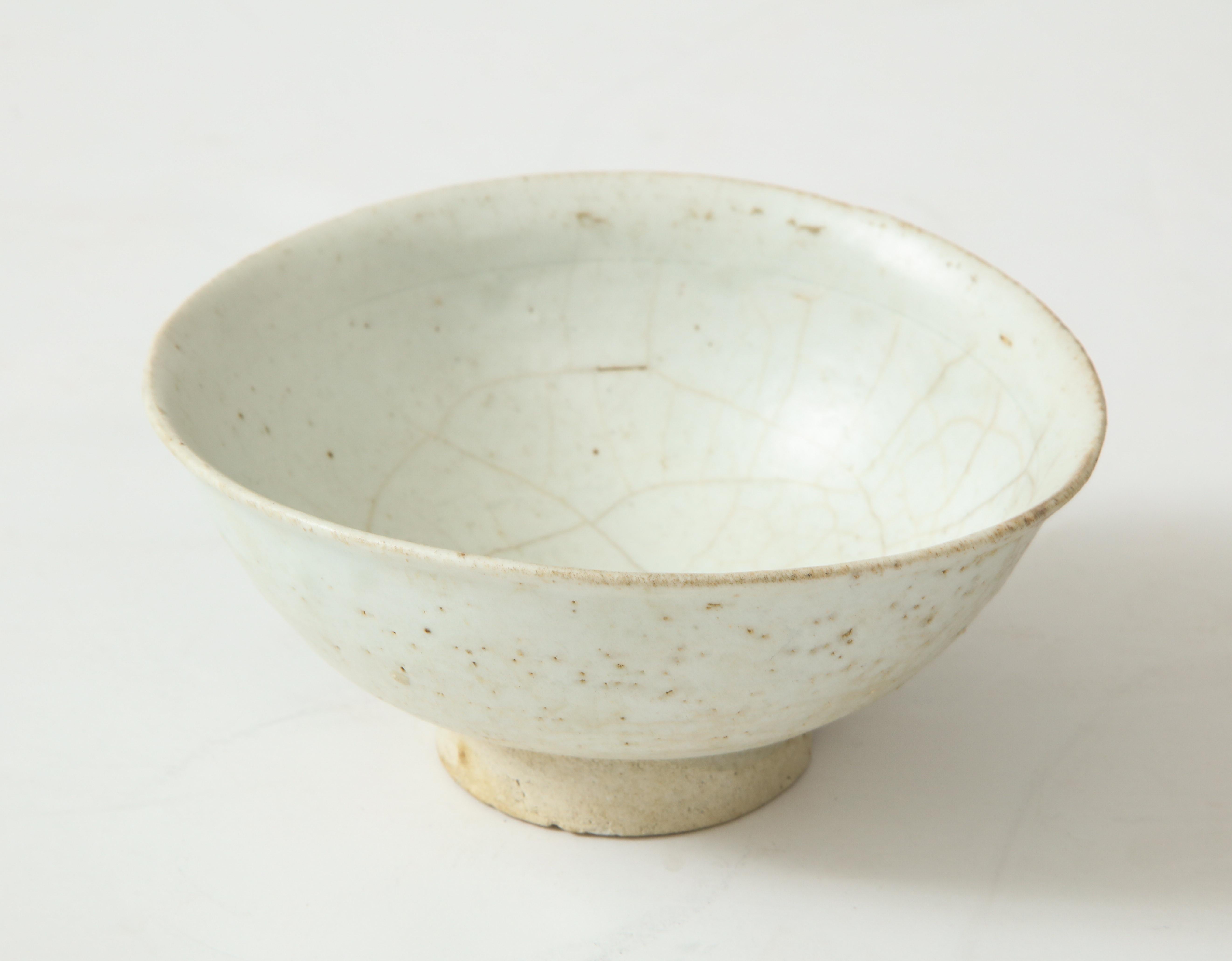 Fine footed porcelain carved Monk's Celadon tea bowl with organic shape, attributed to the Chosen period, Korea.