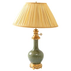 Celadon Porcelain Lamp with a Relief Decor and Gilt Bronze Mount, circa 1880