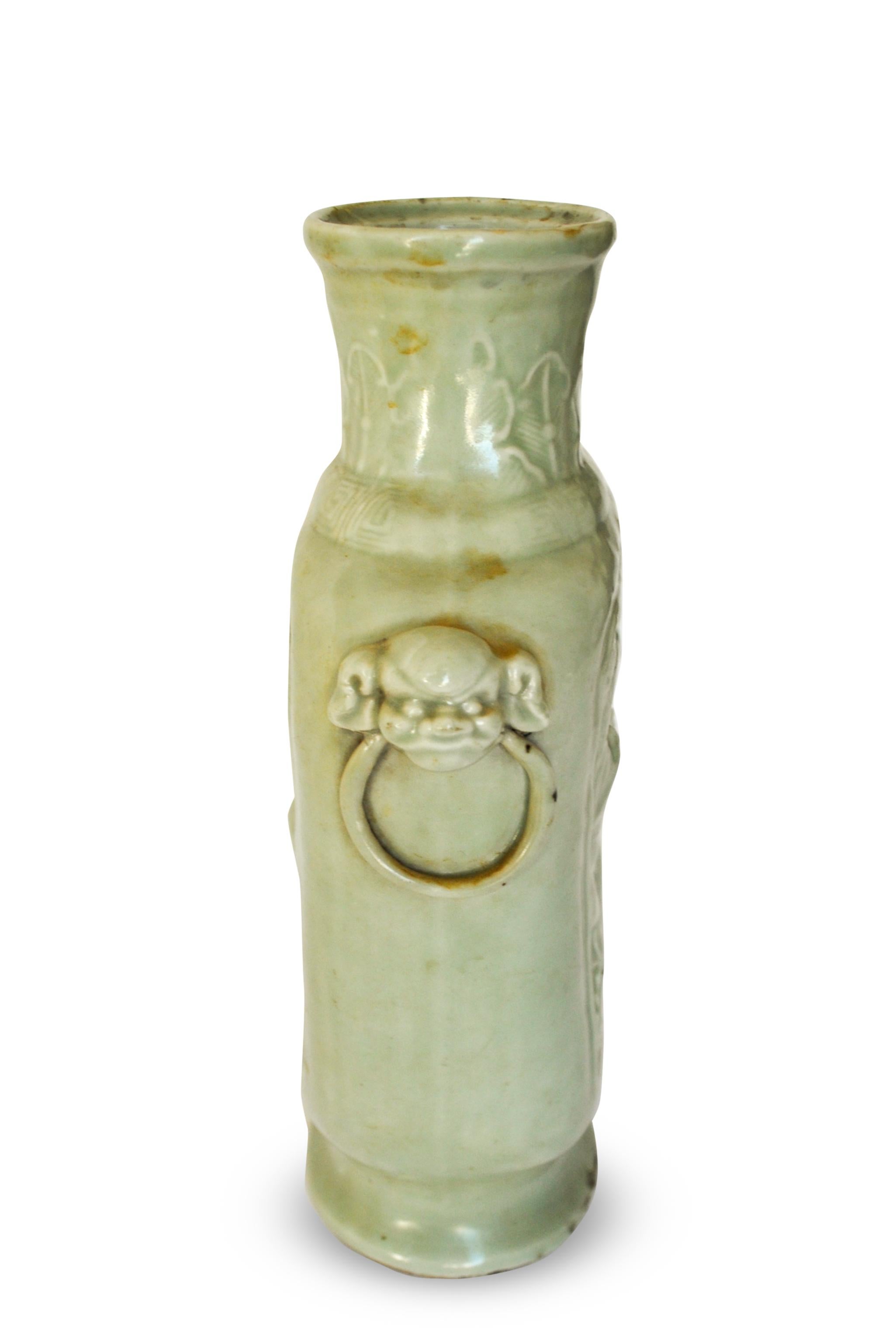 Celadon Porcelain vase is a beautiful Chinese vase of the Kangxi period (1654-1722), with an ovoid shape and relief decoration of dragons competing for the flaming pearl.

At the base, Chinese characters are engraved.

In excellent condition,