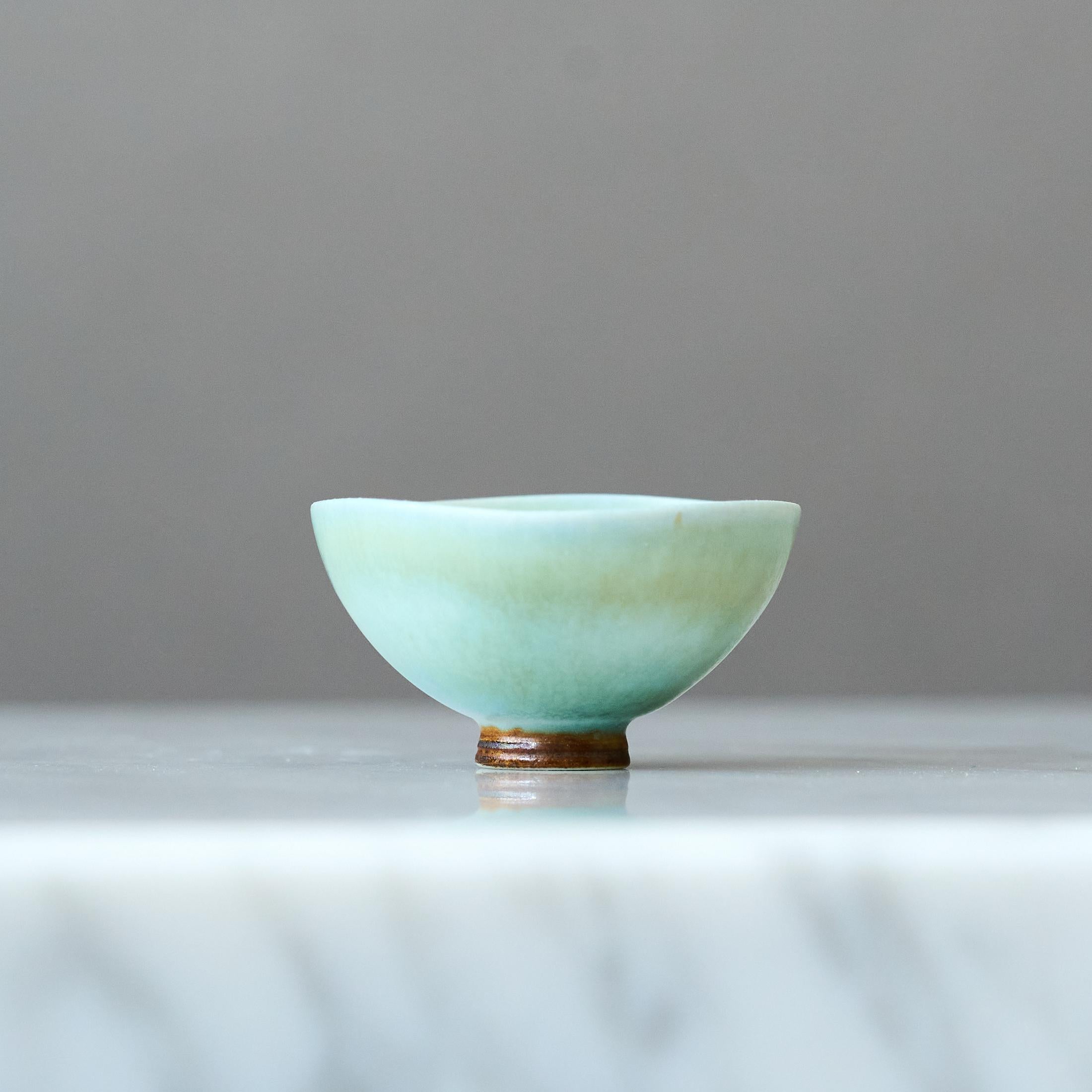 A beautiful miniature stoneware bowl with amazing celadon / light blue-green hare’s fur glaze.
Made by master thrower Berndt Friberg, in the artist's studio at Gustavsberg, Sweden, 1960s.

Great condition. 
Incised signature 'Friberg' and