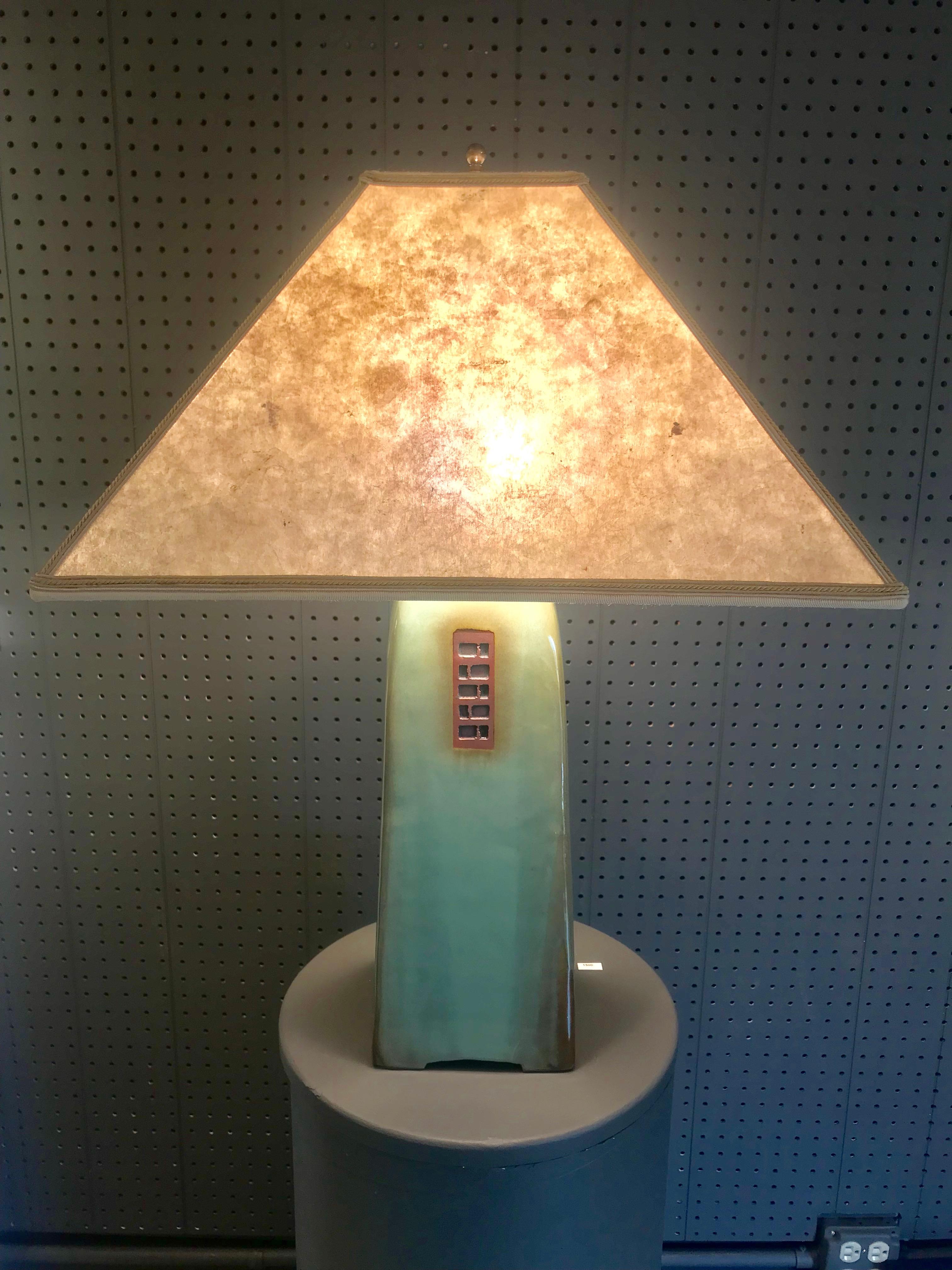 Gorgeous 26 inch high North Union Collection lamp in celadon glaze with silver mica shade by renowned artist Jim Webb. There are beautiful decorative brown geometric decorations and indentations.
Dimensions: Footprint: 6 x 6 
Height of base