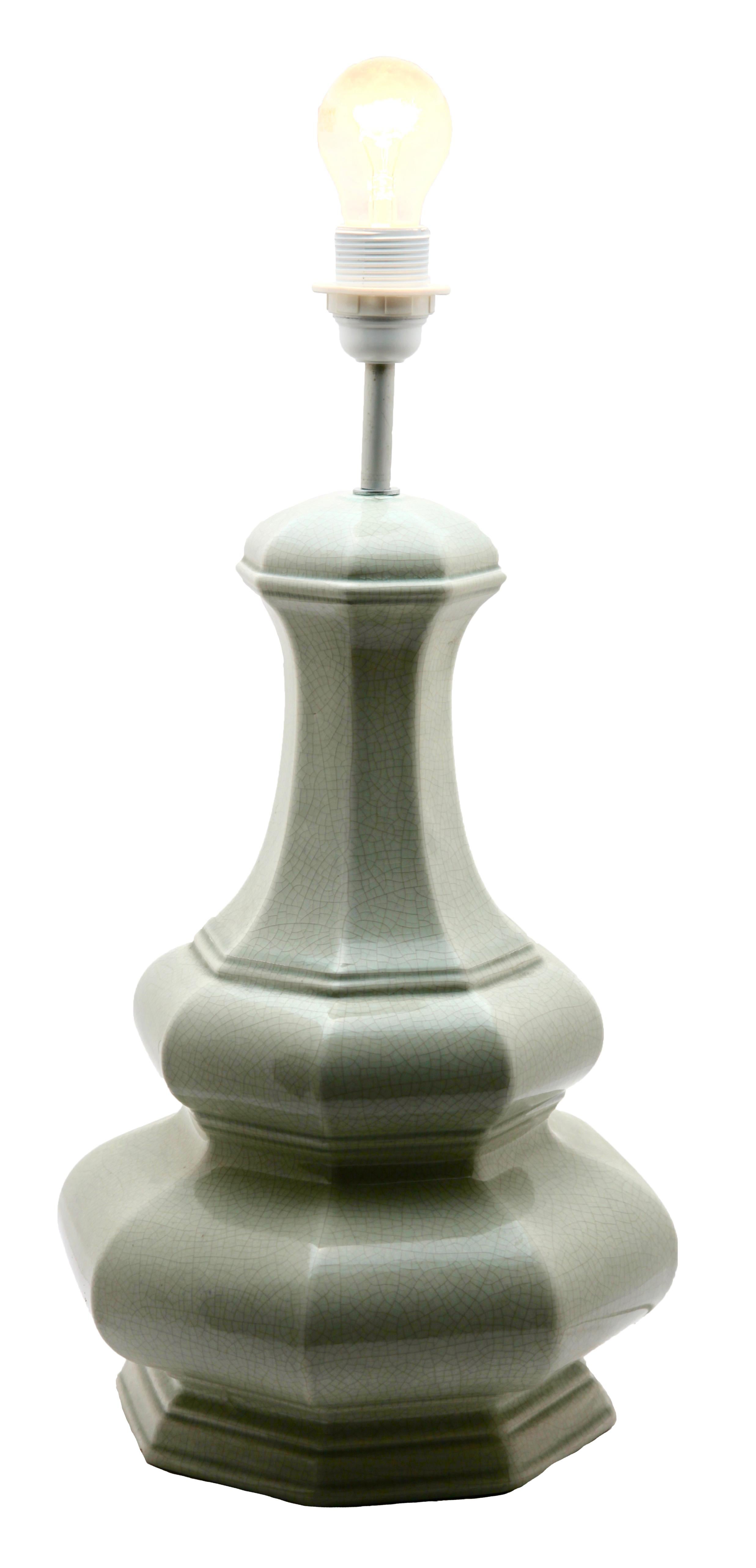 A pale jade celadon table lamp in the Chinese style. Fine craquelure glaze in pale green, on a moulded base of white ceramic.

Inspired by a centuries old technique of Chinese ceramics, this elegant table lamp is a subtle and light shade of jade