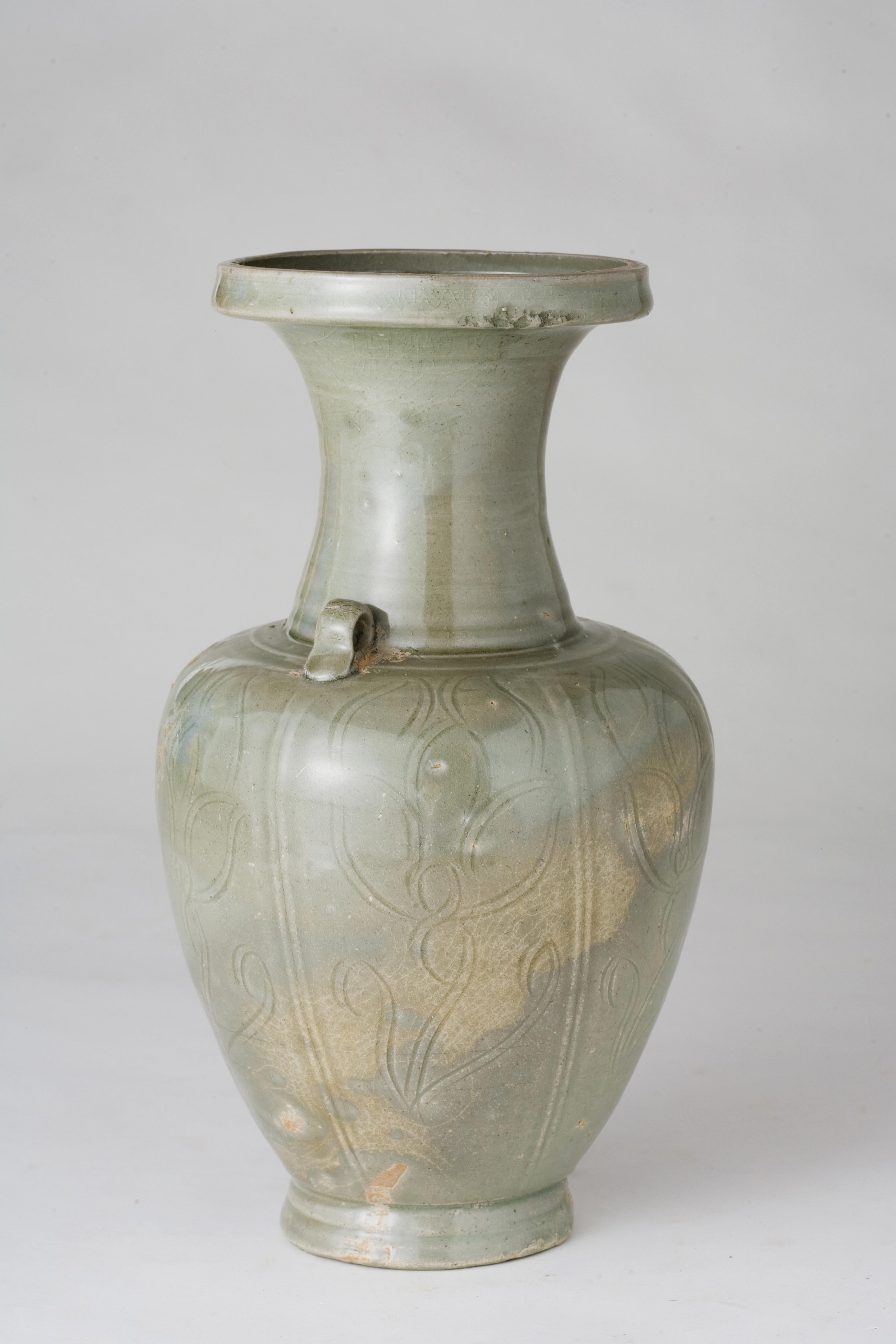 The form of Longquan celadon vases from the Northern Song dynasty evolved from an early design with a long neck and tapering body to a later ovoid body with a shorter neck. Over time, the glaze developed a more olive tone, and the carved decorations