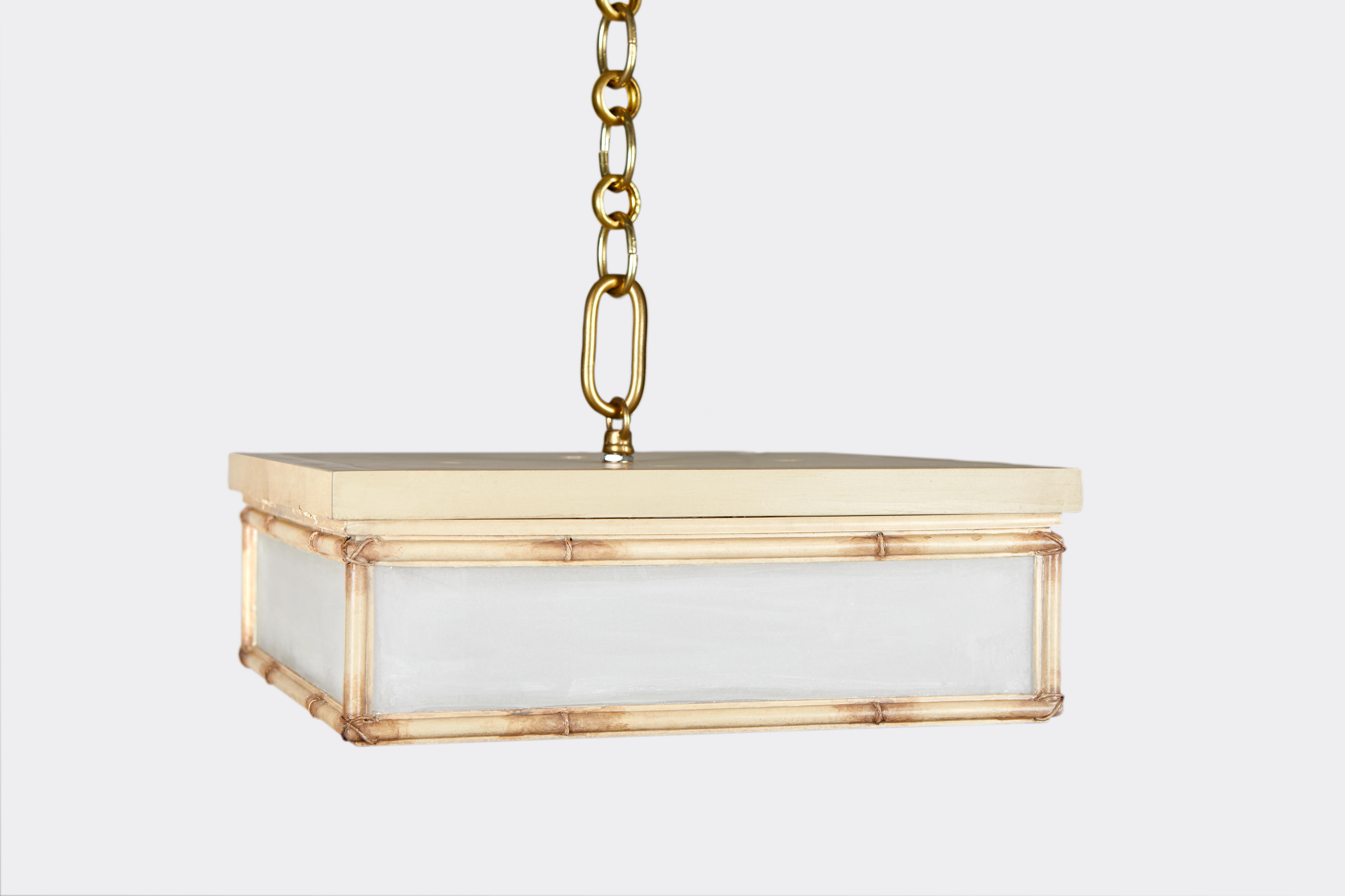 A square, flush mount light fixture designed by David Duncan. This exquisite flush mount fixture showcases hand painted, gold bamboo details on a painted frame. Each handcrafted fixture comes with the option of frosted glass or clear glass panels,