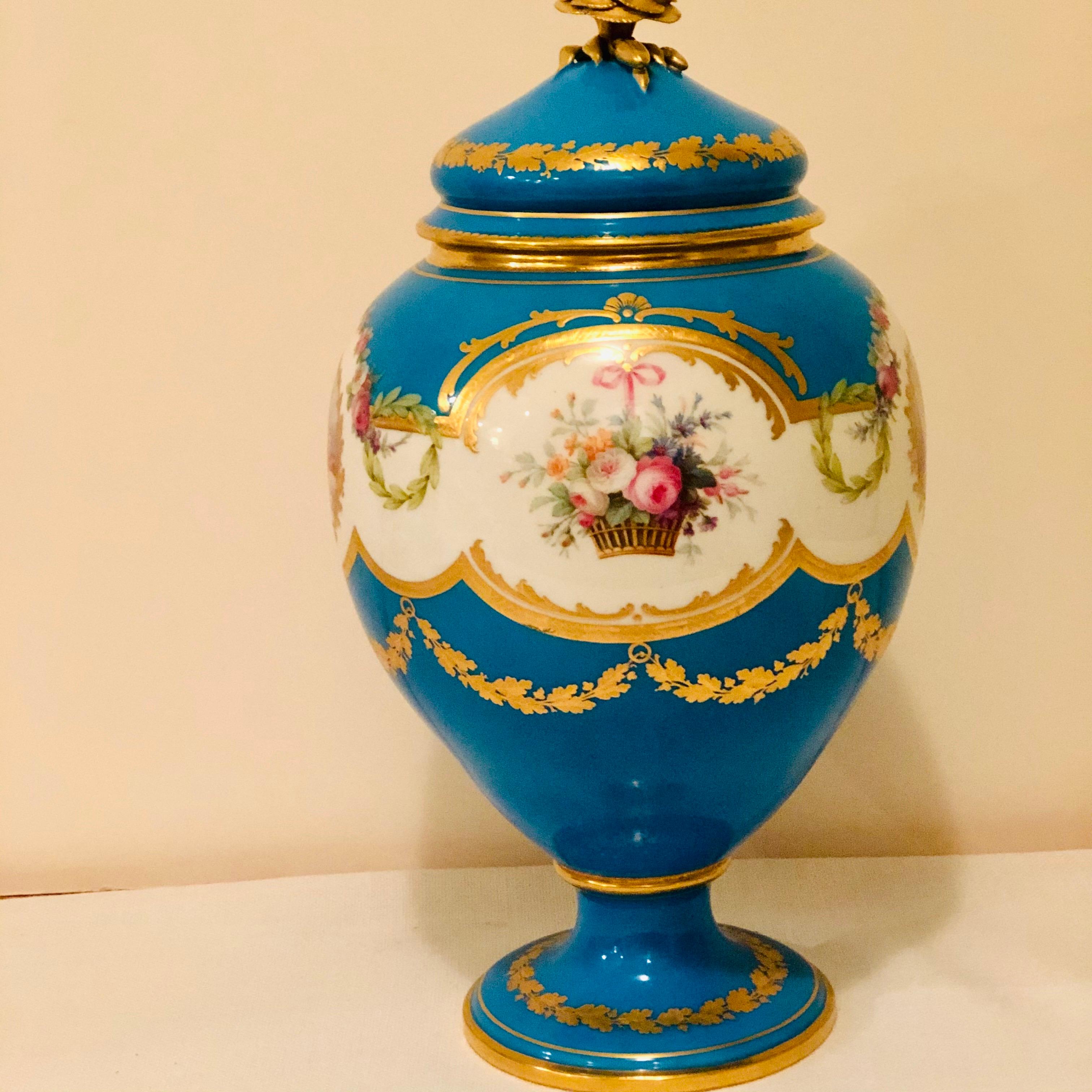 Hand-Painted Celeste Blue Minton Urn Painted with Cherubs and Flowers in the Style of Sèvres