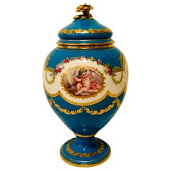 Celeste Blue Minton Urn Painted with Cherubs and Flowers in the Style of Sèvres