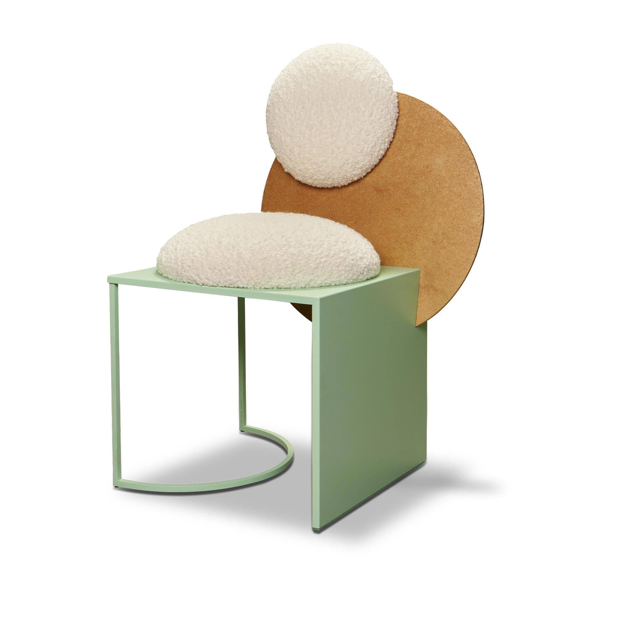 Celeste chair plays with contrasting shapes, materials and textures. The circles and squares join to make a chair that has both substance and lightness. The seat is dramatically transected by the large circular back.

The chair’s seat is made of