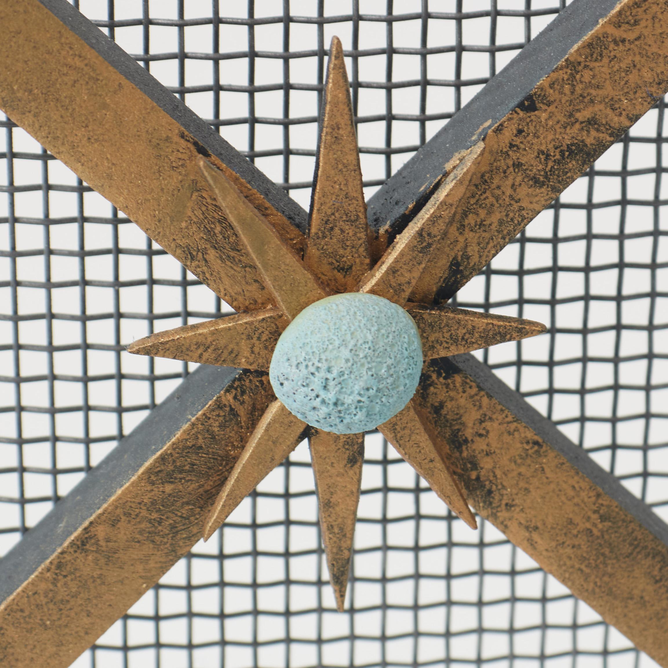 The Celeste Fireplace Screen's hand-forged star points and colorful, textural ceramic spheres evoke the beauty of a clear night sky. The solid iron frame, crossbar motif, and cheerful decorative elements are skillfully built by American artisans.